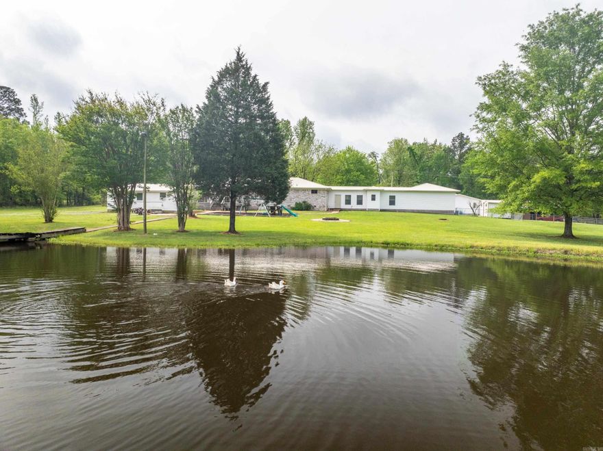 Check out this stunning property featuring four spacious bedrooms, 2 1/2 bathrooms, 2 car garage, security system, 50 amp RV hookup with parking pad behind the shop.. detached shop with water and electric and a large living room with a wood-burning fireplace, ideal for cozy gatherings. Embrace the beauty of nature on this 3 plus acres offering beautiful landscape and rolling hills, complete with a serene large stocked pond perfect for relaxation. Whether you're enjoying the scenic views or entertaining guests, Don't miss your chance to make this picturesque retreat yours   Back on market due to no fault of seller so take advantage of this chance to own this home!  schedule a viewing today!