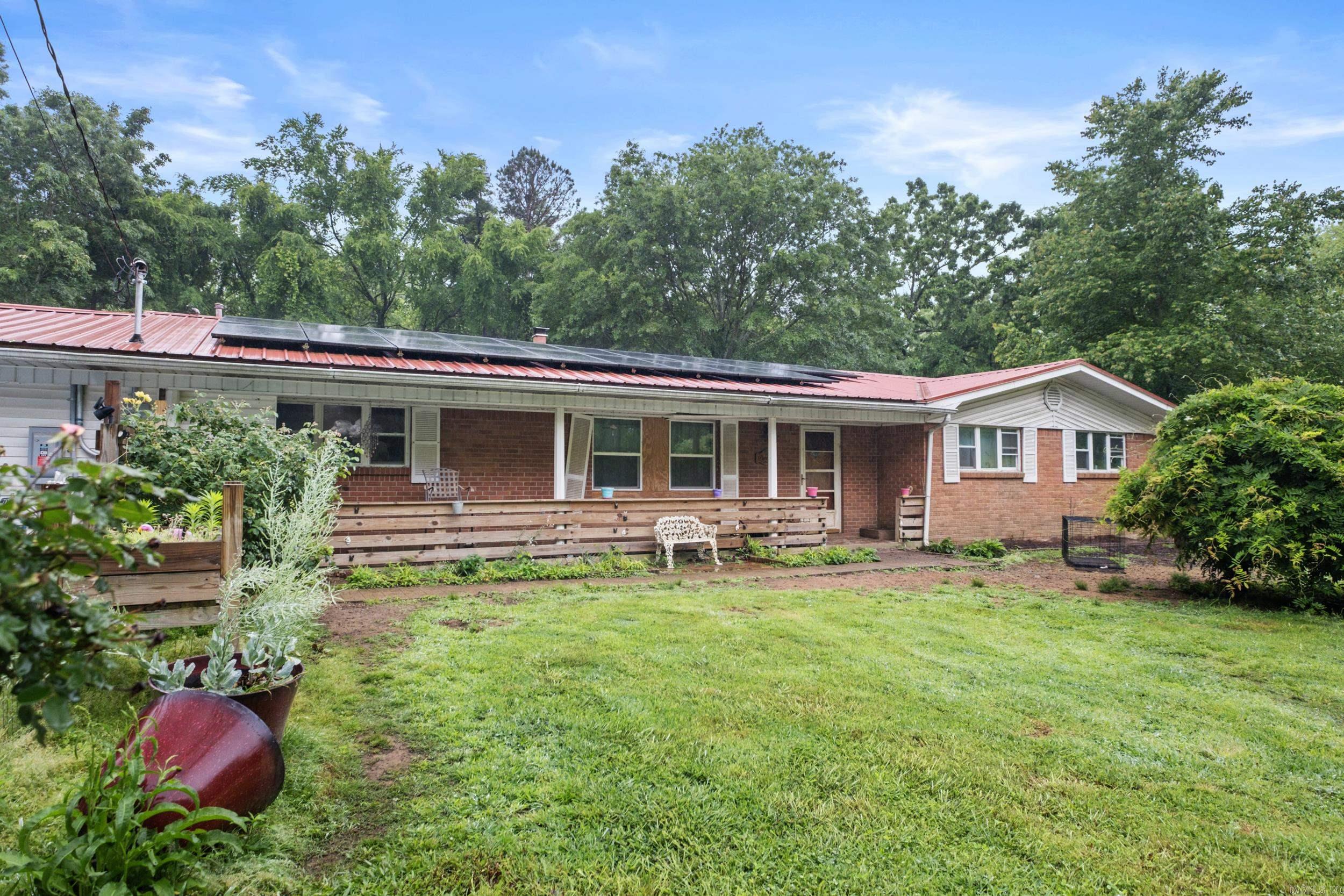 Unlock the potential of this 3-bedroom, 2-bath home on a spacious 1 acre lot in the serene Harbor Hill neighborhood! Perfect for DIY enthusiasts, this property needs TLC but offers endless possibilities! Enjoy proximity to Greers Ferry Lake, ideal for outdoor lovers. Priced to sell and solar panels convey for energy efficient living. Seize this chance to create your dream retreat! Schedule a tour today!