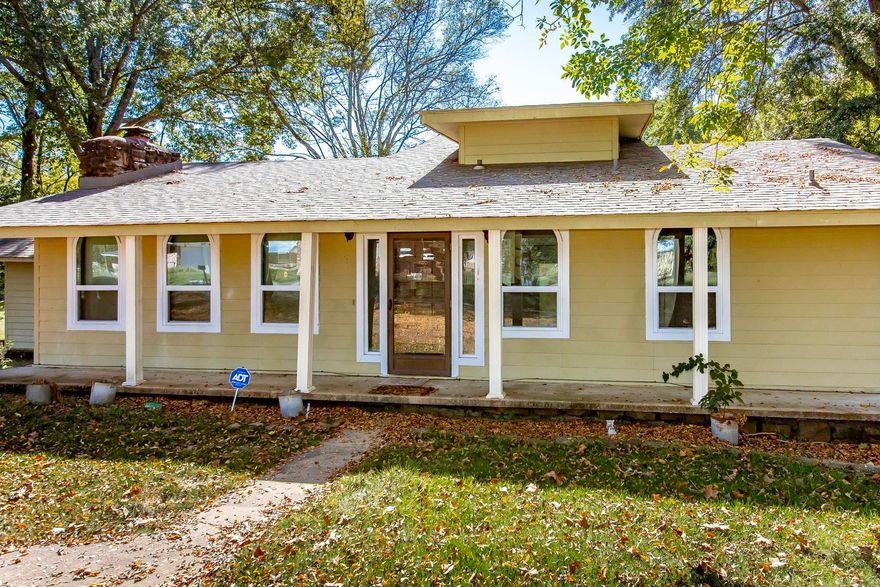 MORRILTON ACREAGE OASIS! Rare 3 Bed, 3 Bath home with two living areas on 3.20 acres inside city limits, offering a true country feel. Enjoy mature shade trees and backyard wildlife. Features include a large sunroom/den with wood burning stove, and an expansive covered back deck—perfect for year-round entertaining. UNIQUE KITCHEN! This unforgettable kitchen has tons of character. The rest of this solid home is a design-ready canvas priced for you to add immediate value and define every space with your own custom taste and flair. City convenience meets rural tranquility! Contact agent for showing.