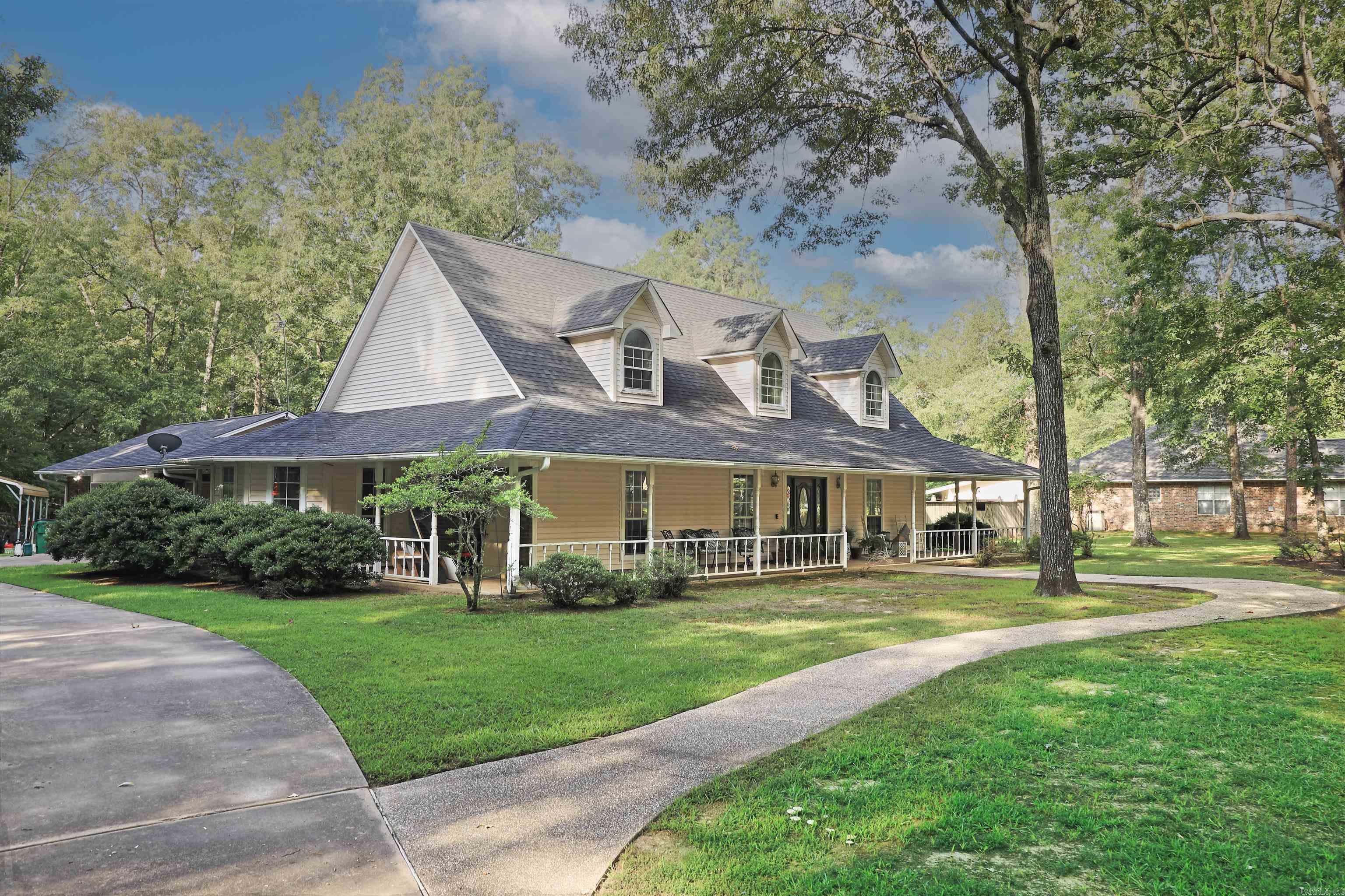 Welcome to the home of CUSTOM EVERYTHING!! STUNNING 4 BR 2.5 BATH home on 2.39 acres. This is a forever family dream home! The expansive kitchen boasts cabinet space galore and a huge dining breakfast bay window that will provide many wonderful moments from family dinners to afternoon coffee. Step into the vaulted living area with shared formal dining and a curved heirloom staircase and floor to ceiling fireplace. Off the living area, you will find a gorgeous sunroom for sitting, crafting, or anything your heart desires. The foyer opens to a bonus room that is currently a mancave office. Bottom floor also serves as the master bedroom suite that has an elegant fireplace and mantle for romantic evenings. The master bath gives a spa getaway vibe with soaking tub and large his and her sinks and closets. Upstairs has three spacious bedrooms, with a full bath and bonus room as well! Ready to shop? Eat? Bank? This home is less than 5 minutes from anything White Hall has to offer! This home is located in the very sought after Boastwood subdivision which exceeds its reputation as a safe and beautiful area to live and raise your family. 2 car garage and 2 car covered carport. Call TODAY!