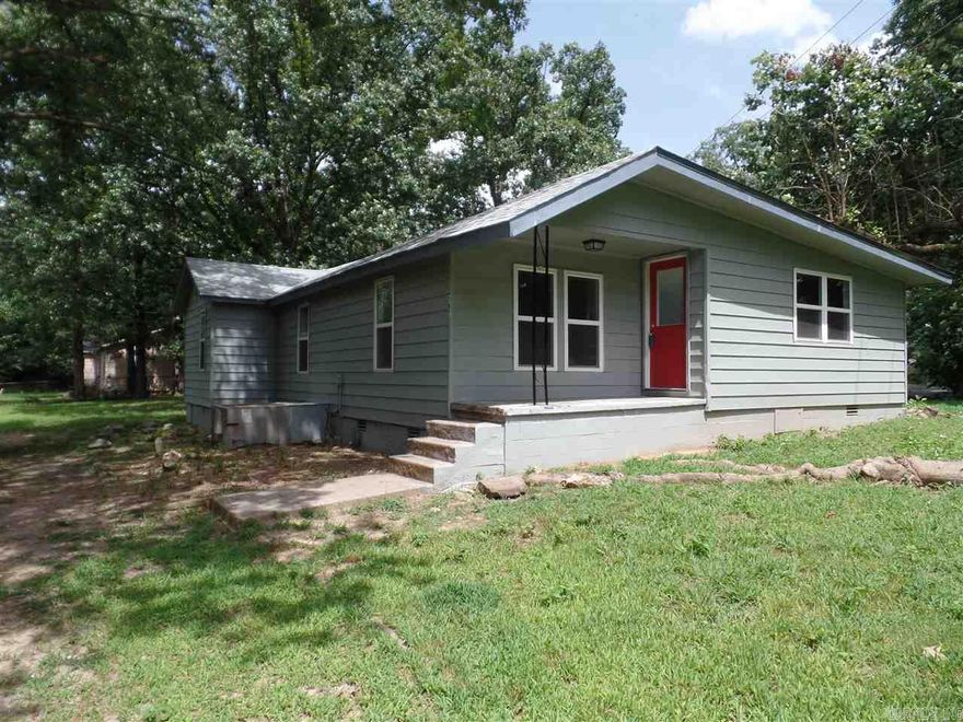 Ready to move into.  Open floor plan.  Living room is totally open to the Kitchen.  Upgrades are extensive.  New roof, hot water tank, cabinets, countertops, bathrooms, carpet, wood floors.  Over an half acre all level.  It also has a detached 2 car carport with a concrete wall  storage building.