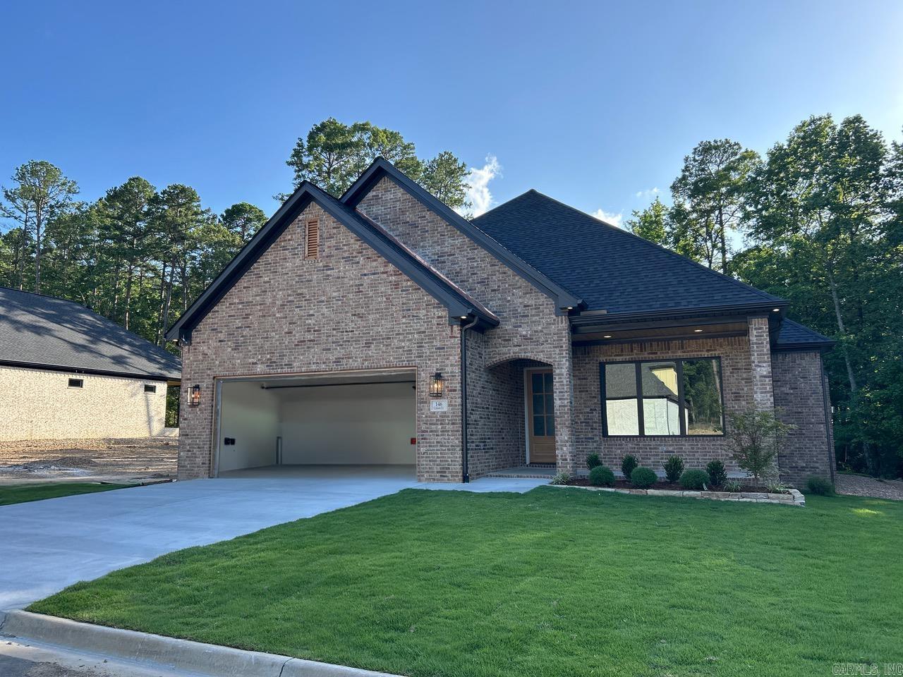 146 Calion Court in Chenal Valley is almost ready to call home! Enjoy this spacious open floor plan at the end of the cul de sac surrounded on three sides by greenbelts. The kitchen is gorgeous with upgraded countertops and appliances. The primary suite is outstanding with a spa bath and walk in closet. An additional bedroom with a full bath and walk-in closet is on the main level and two additional bedrooms with a full bath are upstairs. The covered patio is ready to hang the television and hook up the gas grill! Storage is amazing. Call today for a design board and an appointment.