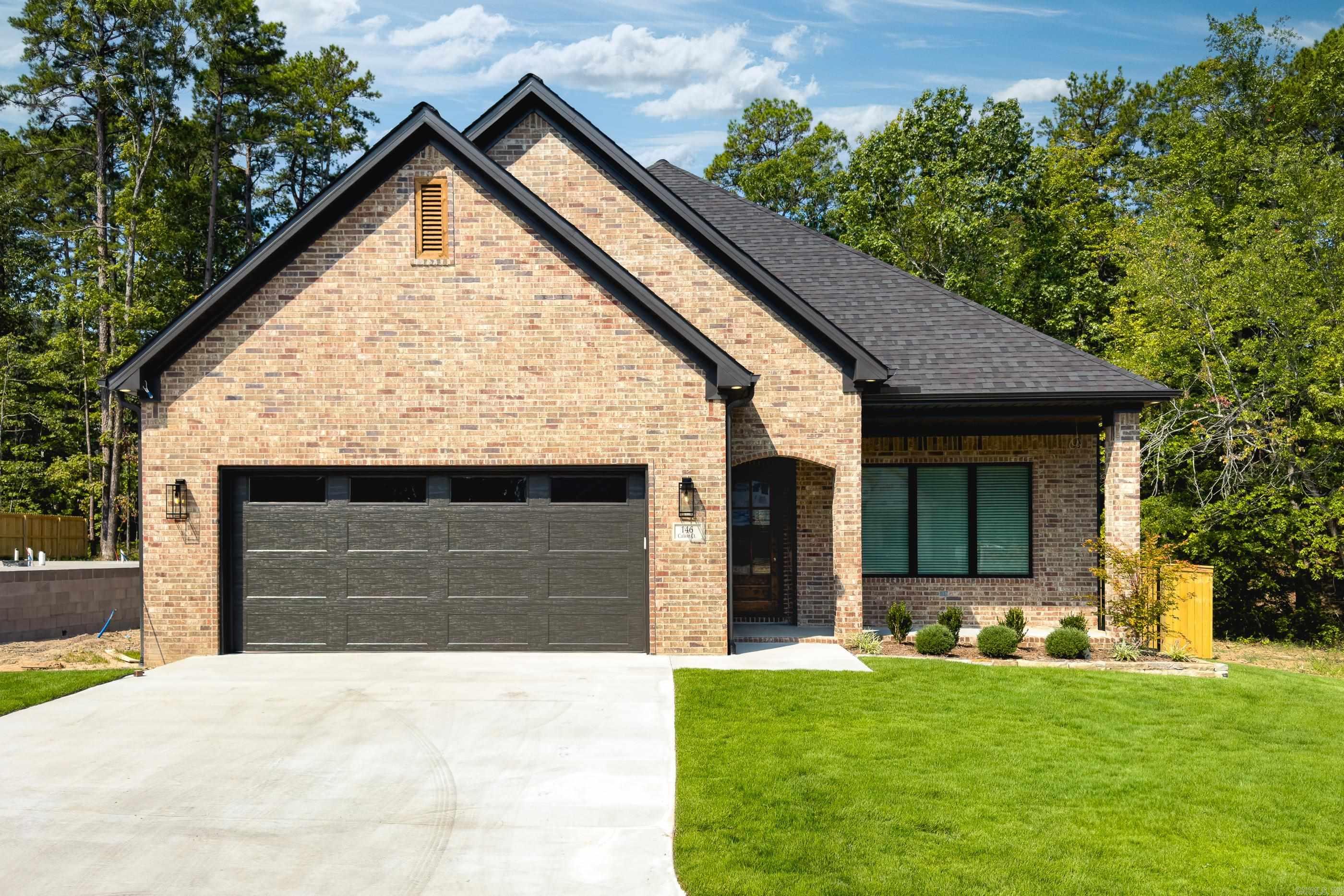 146 Calion Court in Chenal Valley is ready to call home! Enjoy this spacious open floor plan at the end of the cul de sac surrounded on three sides by greenbelts. The kitchen is gorgeous with upgraded countertops and appliances. The primary suite is outstanding with a spa bath and walk in closet. An additional bedroom with a full bath and walk-in closet is on the main level and two additional bedrooms with a full bath are upstairs. The covered patio is ready to hang the television and hook up the gas grill! Privacy fence is installed as well as window coverings! Storage is amazing. Call today for an appointment.