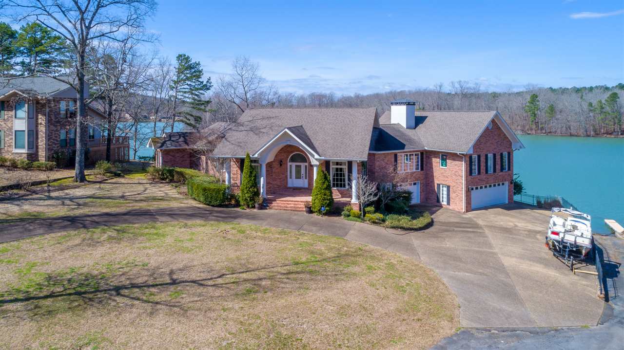Spectacular panoramic views upon entering this beautiful two level home on the scenic Big Mazarn deep water with own boat launch & covered dock. Designed for indoor/outdoor year round entertaining. Open views of the lake, covered patios, courtyard & fountain for lakeside dining. Expansive in-law, guest quarters own garage downstairs. All furnishings, fixtures, equipment & accessories included. Stately home you don't want to miss viewing, move in ready!