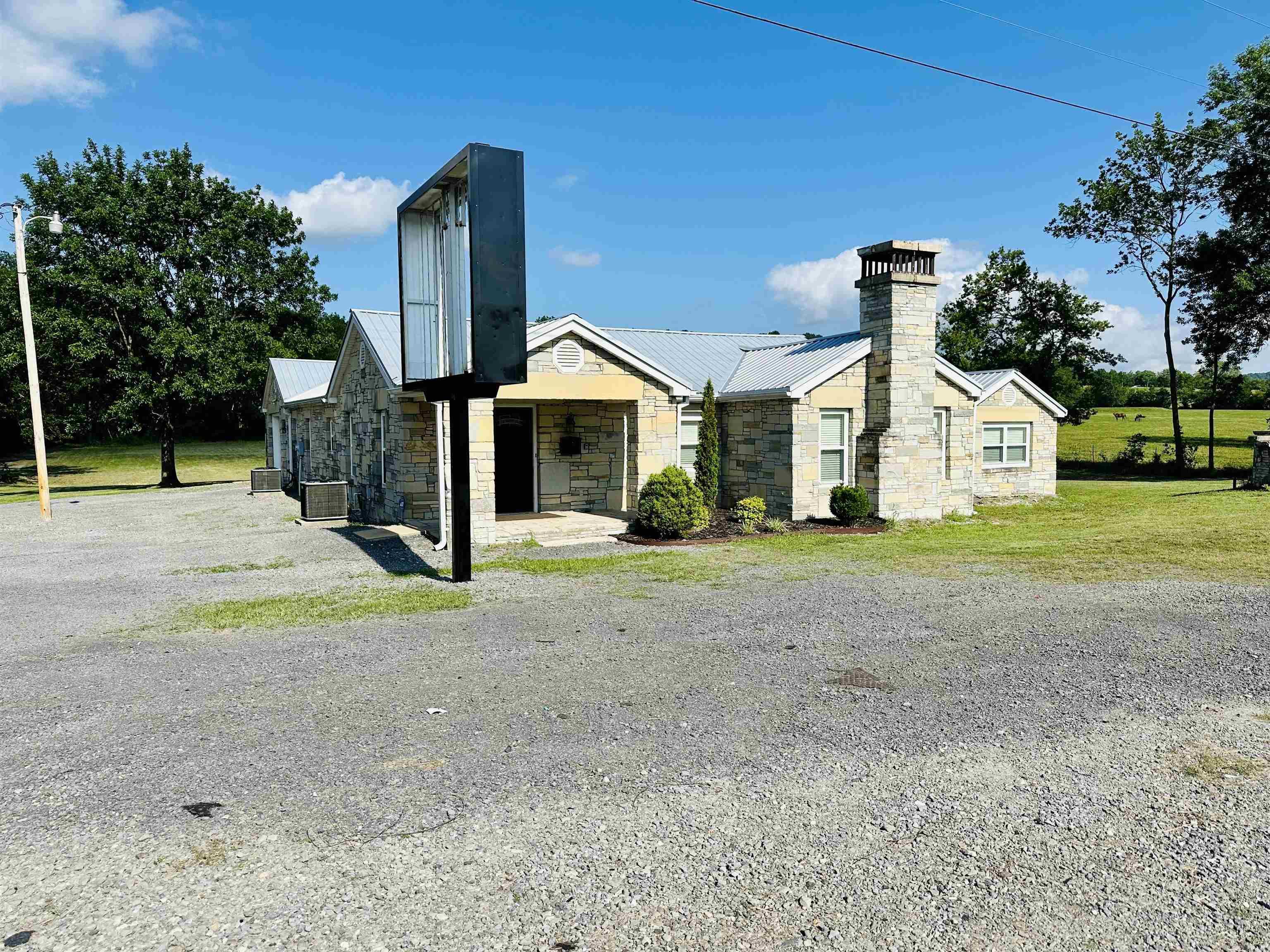 This property is a versatile opportunity for both residential and business use. With multiple rooms that can easily be converted into bedrooms. The home/business also has a laundry room, 1 full bath and half bathroom, it offers plenty of functional space. The property is equipped with two separate heating and cooling systems, including a climate-controlled garage, ensuring comfort in all areas. The back patio provides a great outdoor area for relaxation or entertaining. While there’s no fully developed kitchen, it does feature a cook stove and sink, making it adaptable for various uses. This is an ideal setup for someone seeking a flexible living and business space combined.