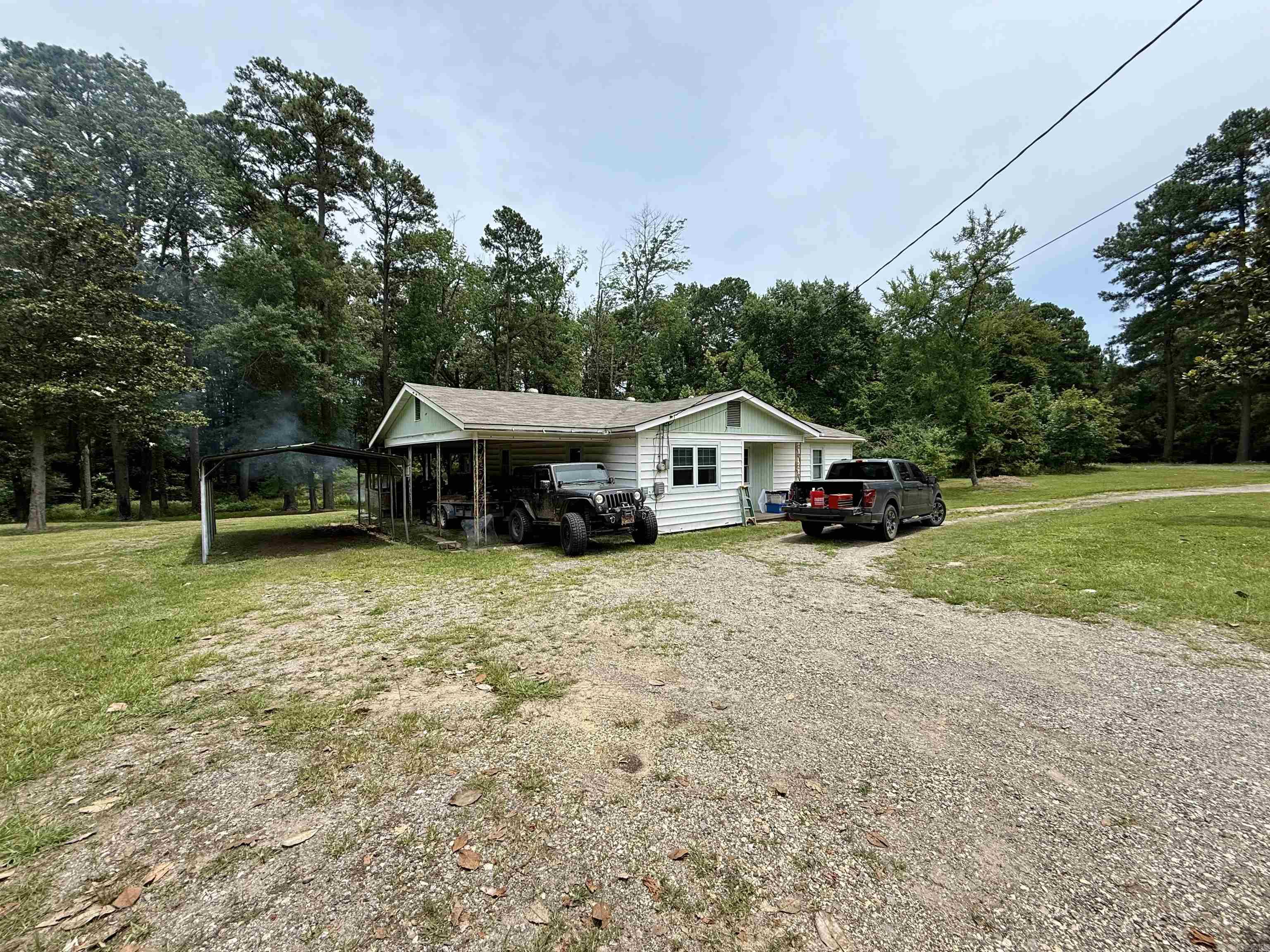 TWO HOMES | 2.67 ACRES | PRIME MT. HOLLY ROAD LOCATION Opportunity awaits on this rare 2.67-acre property featuring two homes just outside of town on the highly sought-after Mt. Holly Road. The possibilities are endless—whether you're looking for a multi-generational setup, rental income, or space to renovate and customize to your liking. Main Home: This 3-bedroom, 1.5-bath home offers a spacious layout with tons of potential. With a little TLC, this property can be transformed into a beautiful retreat. The layout makes it easy to convert the half bath into a second full bath, adding even more value. Second Home: The second house on the property needs a bit more work but provides great bones and a blank canvas for your vision - ideal for a guest house, in-law suite, or potential rental income. Enjoy the peaceful setting with room to spread out, garden, or build. Properties like this, with two homes and acreage in such a prime location, don’t come around often. Don't miss your chance to invest, restore, and create something special!