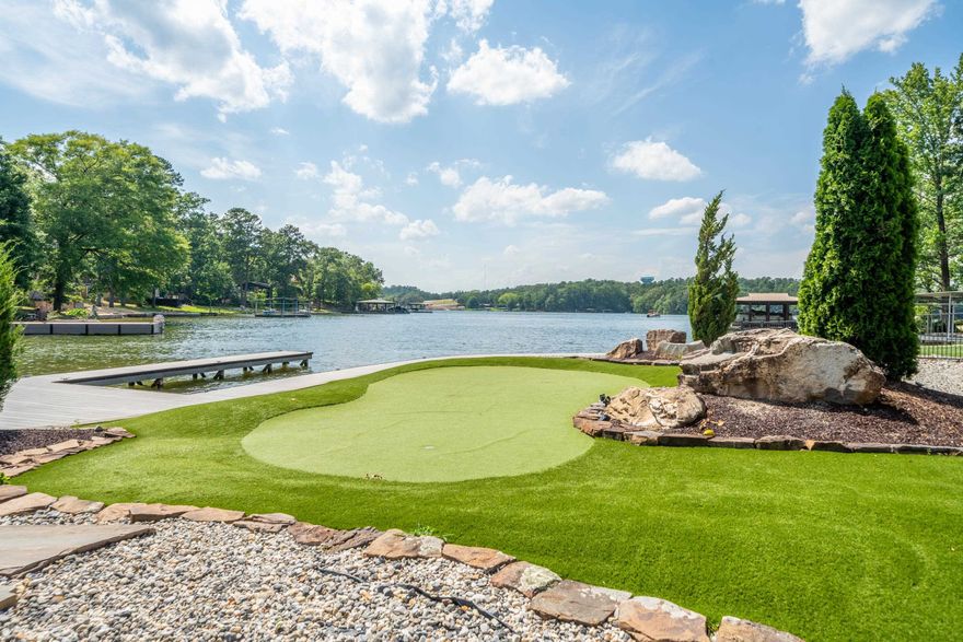 Introducing the epitome of luxury lakeside living on Lake Hamilton at 500 Bayshore. Nestled in the heart of Hot Springs this home offers an unrivaled experience in short-term rental accommodation. Perched majestically on the pristine shores of Lake Hamilton, this property is over 3400 square feet of carefully designed living space, meticulously crafted to exude sophistication and charm at every turn. The residence boasts panoramic views of the serene waters, inviting guest to immerse themselves in the tranquility of lakeside living. With approximately 150 feet of private lake frontage, guests have exclusive access to the shimmering water, where endless aquatic adventures await. A private boat slip offers the perfect launching point for exploring the vast expanse of Lake Hamilton, whether by boat, jet ski or paddleboard. For those seeking relaxation and rejuvenation, indulge in the ultimate in leisure in the hot tub, where the soothing water provide the perfect escape from the hustle and bustle of everyday life. Take in some golf practice on the putting greens, or enjoy the beauty of the beautiful water features. Cont'd in Agent Remarks..