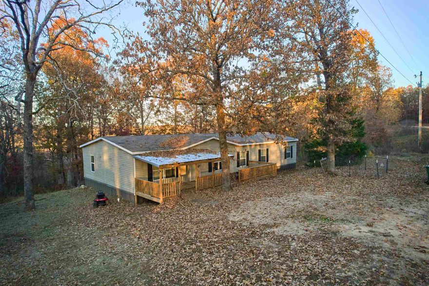 Welcome to your Country Home in the Ozarks!! This Beautiful home is privately located close to Spring River and Mammoth Spring State Park. A trout and bass fishing paradise is just a short distance away. Canoeing, floating and swimming in the Summer. Hunting in the Fall/Winter in your own back yard!! This Beautiful 2021 manufactured Home is over 2000 sq ft and sits on 5 UNRESTRICTED acres, mostly wooded, with abundant wildlife. Includes 4 bedrooms, 2 bathrooms, 2 living rooms. Perfect for multi-generational living. - Grand open floor plan! Kitchen has large island and Stainless steel appliances. Main bedroom with ensuite is large with separate bathtub, walk in shower and huge walk-in closet. Very spacious rooms with hard surface flooring through-out. New Deck in 2025! Septic and Well installed in 2021. Plus fenced garden area! Come take a look!