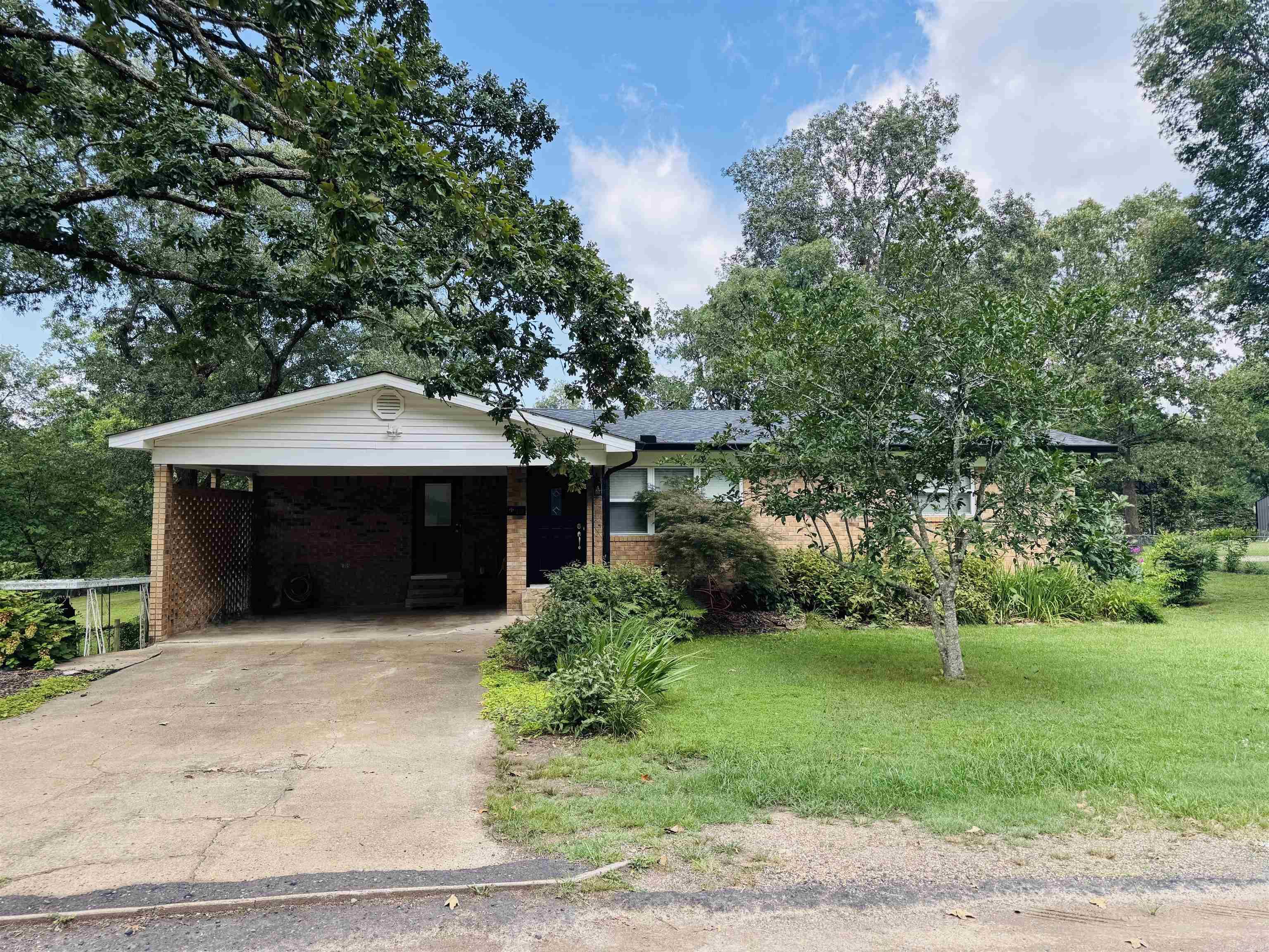 Welcome to 116 Brookdell place!! This all brick split level is just a short walk to Lake Hamilton where all the fun happens. Very rare opportunity to have the amenities of lake living without the lake PRICE. Nice big kitchen that is open to dining area and living room makes a great spot to entertain guests. This home is sitting on a double lot with 1/2 an acre, and a huge back yard to enjoy! This quiet neighborhood has its own personal dock on the water and boat ramp to launch your toys. Property has a separate drive way with 2 covered awnings, storage building, and a carport to boot. Architectural roof, gutters and siding all replaced last year and H/VAC is only 5 years old. Windows have been replaced as well with double pane insulated, so all the big ticket items you won't have to worry about. The walk out basement makes a great layout with a separate entrance for a game room or would be fantastic in-law quarters. Lots of room under house for storage if needed, and a blank slate down stairs to turn this into a perfect Airbnb. Don't miss this opportunity to have all Hot Springs offers, with this well loved property. Call your agent and book your showing today!