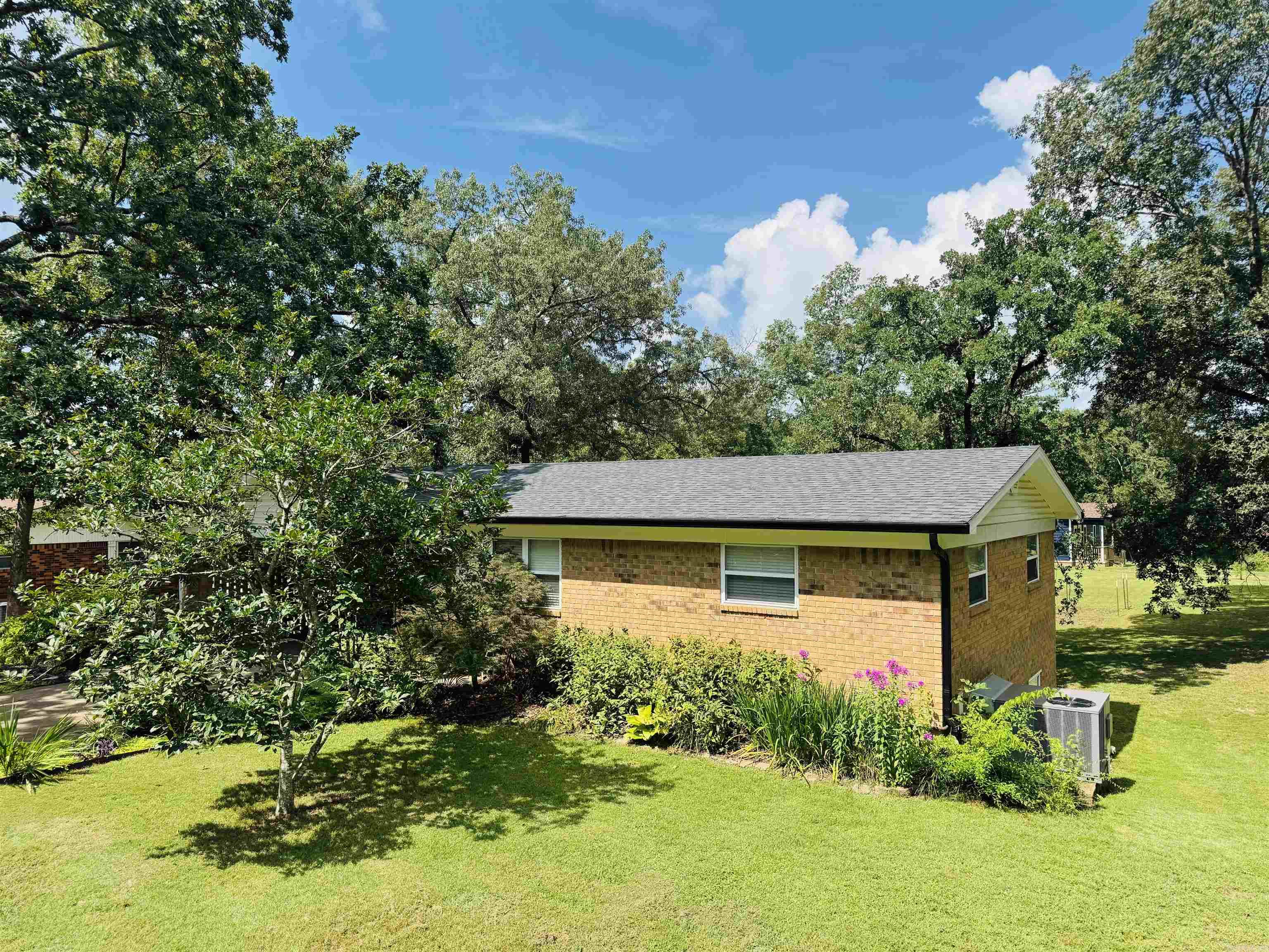 Welcome to 116 Brookdell place!! This all brick split level is just a short walk to Lake Hamilton where all the fun happens. Very rare opportunity to have the amenities of lake living without the lake PRICE. Nice big kitchen that is open to dining area and living room makes a great spot to entertain guests. This home is sitting on a double lot with 1/2 an acre, and a huge back yard to enjoy! This quiet neighborhood has its own personal dock on the water and boat ramp to launch your toys. Property has a separate drive way with 2 covered awnings, storage building, and a carport to boot. Architectural roof, gutters and siding all replaced last year and H/VAC is only 5 years old. Windows have been replaced as well with double pane insulated, so all the big ticket items you won't have to worry about. The walk out basement makes a great layout with a separate entrance for a game room or would be fantastic in-law quarters. Lots of room under house for storage if needed, and a blank slate down stairs to turn this into a perfect Airbnb. Don't miss this opportunity to have all Hot Springs offers, with this well loved property. Call your agent and book your showing today!