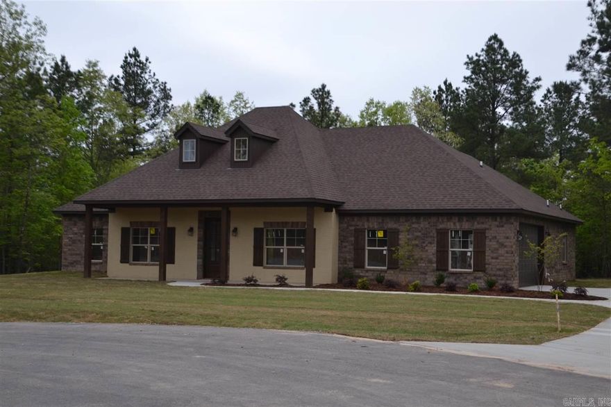 COUNTRY SETTING YET CLOSE TO TOWN!!! THIS 2130 SQ FT HOME OFFERS 4BR/2BA, SPLIT BEDROOM FLOORPLAN, FORMAL DINING ROOM, GRTRM W/WOOD BURNING FIREPLACE, LIVING RM OPEN TO KITCHEN WITH LARGE ISLAND, LAUNDRY ROOM,  GRANITE CNTRTOPS THROUGHOUT, HARDWOODS, TILE IN ALL WET AREAS,  LARGE MASTER BATH W/JETTED TUB, SEPARATE SHOWER & WALK-IN CLOSETS, CROWN MOLDING EVERYWHERE, PRIVACY, BRYANT SCHOOLS & MUCH MORE!!!  Please measure to determine square footage accuracy.