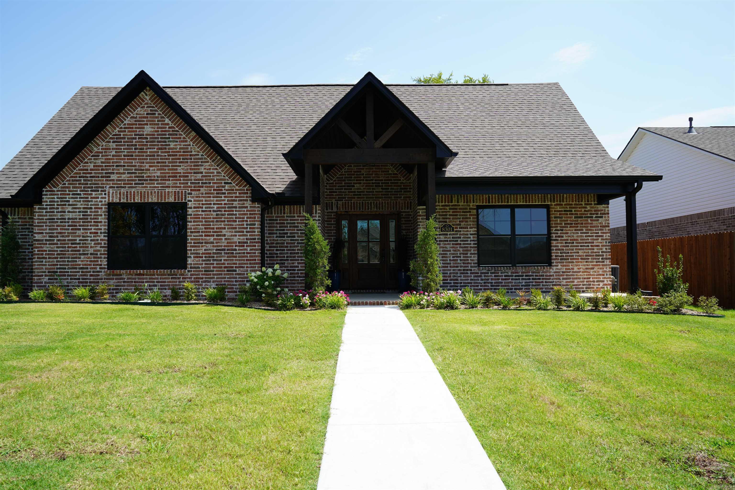 8301 McLaren Dr, Fort Smith, AR 72916 Located in the distinguished Shire Glen at Chaffee Crossing Subdivision, this newly completed Justin Green Custom Home (2025) offers timeless craftmanship, modern luxury and an exceptional floor plan designed for today's lifestyle. This 3-bedroom, 2-bath residence showcases an inviting open concept living space with both an eat-in kitchen and formal dining room- perfect for entertaining and everyday living. The luxury primary suite is a true retreat, featuring a spa-inspired bath and the convenience of direct access from the custom closet to the designer laundry room. Situated on a prime corner lot, the home also boats a side-entry, oversized 2-car garage, adding both curb appeal and functionality. With Justin Green Custom Homes' reputation for honesty and integrity, this property represents not only a home but also a lifestyle investment in one of Fort Smith's most distinguished communities. As an added assurance, Justin Green is offering a 3-year limited builder home warranty- "Quality backed by its Builder."