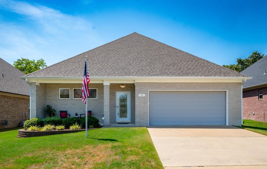 Discover this custom-built, meticulously maintained patio home in the highly sought-after West Little Rock community! Built with family gatherings in mind, this one-level home offers exceptional comfort and convenience with no steps. Nestled in a level, easily walkable neighborhood with minimal traffic, the spacious layout features a kitchen with ample cabinet space and an oversized living room perfect for entertaining. The guest room includes a full bath, making it ideal for out-of-town visitors. Both full baths boast heated floors and large, easy-access showers. Enjoy a dedicated office area with floor-to-ceiling shelves and a heated garage with plenty of storage for hobbies. Unwind on the screened-in patio, ideal for birdwatching or relaxing in your private backyard retreat. The fully irrigated, high-quality lawn is perfect for flowers and feeders that attract birds and butterflies. Conveniently located near grocery stores, shopping centers, schools, and recreational destinations, this charming patio home is a must-see opportunity!
