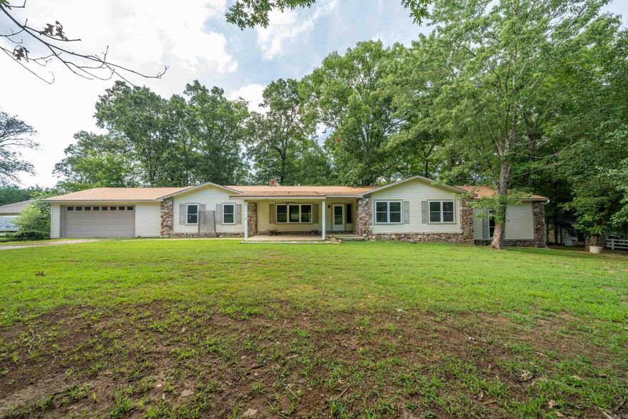 Walk into this spacious 6-bedroom, 3-bathroom residence situated on a 1.51-acre lot. This remarkable house offers a spacious and versatile layout, perfect for those seeking ample space and family comforts. With a total of six bedrooms, there's plenty of room for the whole family or visiting guests. The master bedroom, located on a split level, provides a private retreat with its own en-suite bathroom, ensuring a peaceful sanctuary away from the rest of the house. One of the bedrooms could easily double as a bonus room, allowing you to create a your own space—a home office, media room, or even a gym. The kitchen features a range of appliances, including a built-in electric surface stove, double oven, refrigerator, dishwasher, and microwave.  The property boasts an expansive 1.51-acre lot. Imagine the possibilities this vast space offers: a flourishing garden, a play area for children, or even the addition of a swimming pool or outdoor entertaining area,  the options are truly endless. Nestled in a quiet neighborhood, this property offers both tranquility and convenience. Nearby are Lake Hamilton schools and amenities that are within easy reach, making everyday life a breeze.