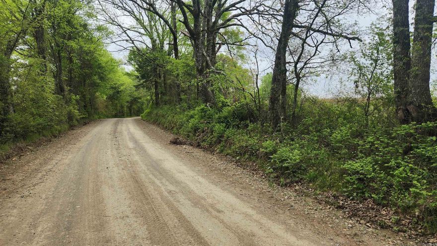 3.02 acres just off Highway 298 East at Story AR. Culvert already installed. Unrestricted. Mineral rights convey. Fenced on 3 sides. Has current survey.  Mountain views. Couple really good house spots. This property will need a well, septic, and electric installed. A little over 2 miles to Lake Ouachita and less than a mile to Ouachita National Forest. Perfect spot for that weekend getaway.