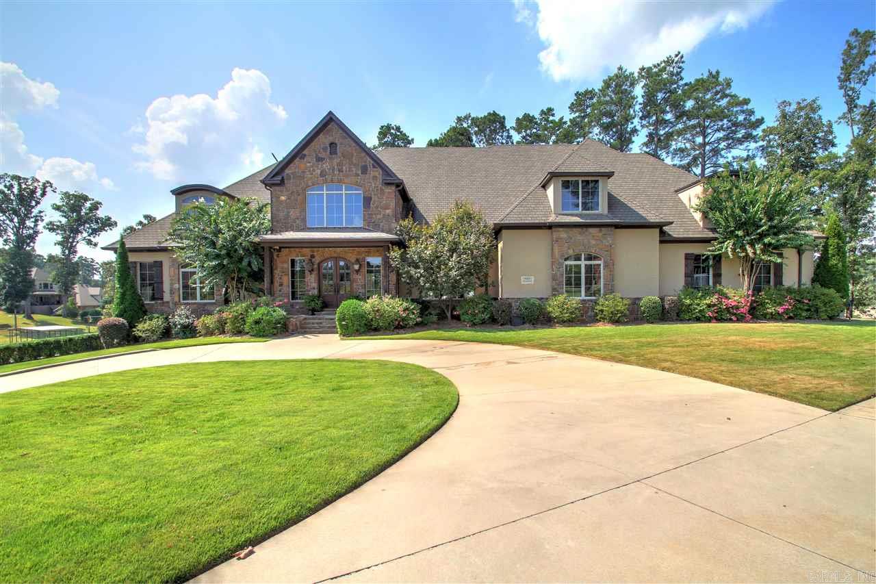 A custom built home behind a gate on Hurricane Lake. Sits on a 1.37 acre point on the lake with breath taking views. This home has everything and more you could desire. With a whole home generator you will always have the comfort of your geo thermal heat and air unit. Other amenities include: heated salt water pool, hot tub, outdoor kitchen, subzero fridge&freezer, central vac, 2 laundry rooms, flag stone porches, cedar basement, 3 fire places, wolf 8 burner stove, and many more extras too many to list