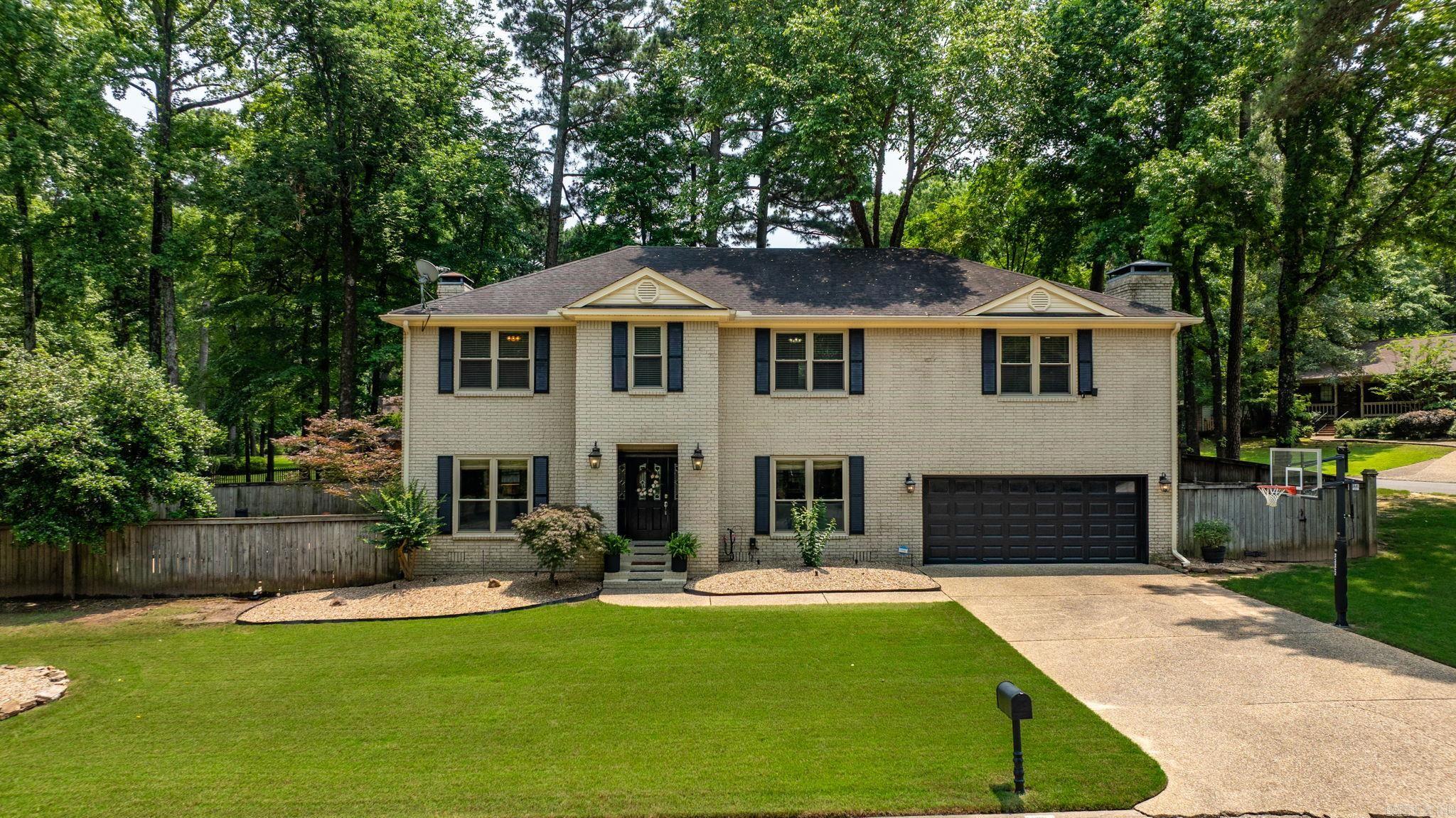 Luxury living in the heart of Riverland! This exquisitely remodeled all-brick estate offers an elegant blend of comfort and sophistication. Situated on a large corner lot, this home features a resort-style saltwater pool with hot tub, koi pond, and professional landscaping with uplighting for stunning twilight ambiance. Inside, enjoy expansive open-concept living with NEW wood flooring, designer lighting, ventless fireplace, and floor-to-ceiling updates. The NEW gourmet kitchen includes premium appliances. Retreat to your NEW luxurious primary suite with its own fireplace, sitting room (ideal for office or gym), and spa-like bath. Second primary suite offers comfort and flexibility. NEW windows, insulation, and pool systems—liner, plumbing, filtration, and electrical. Exceptional storage, oversized guest rooms, and refined finishes throughout make this a true haven for discerning buyers. A rare opportunity for upscale living in one of Maumelle’s most coveted neighborhoods. Agents see remarks for a full list of features and offer instructions.