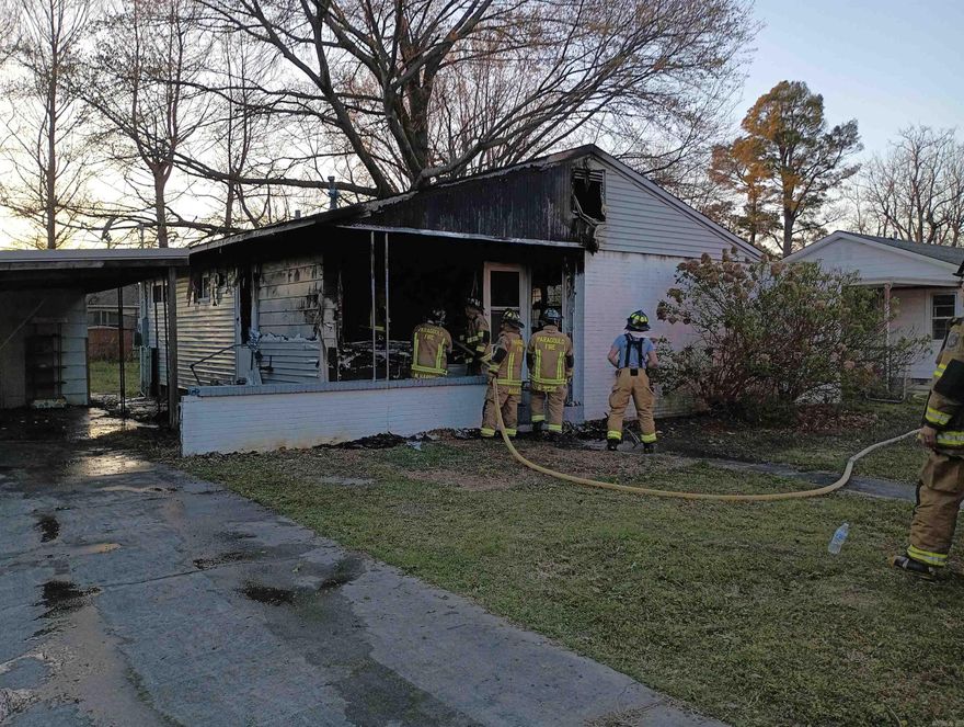 Fire Damaged 2 bedroom, 1 bath home on large shady lot with fenced in backyard, carport with storage building.