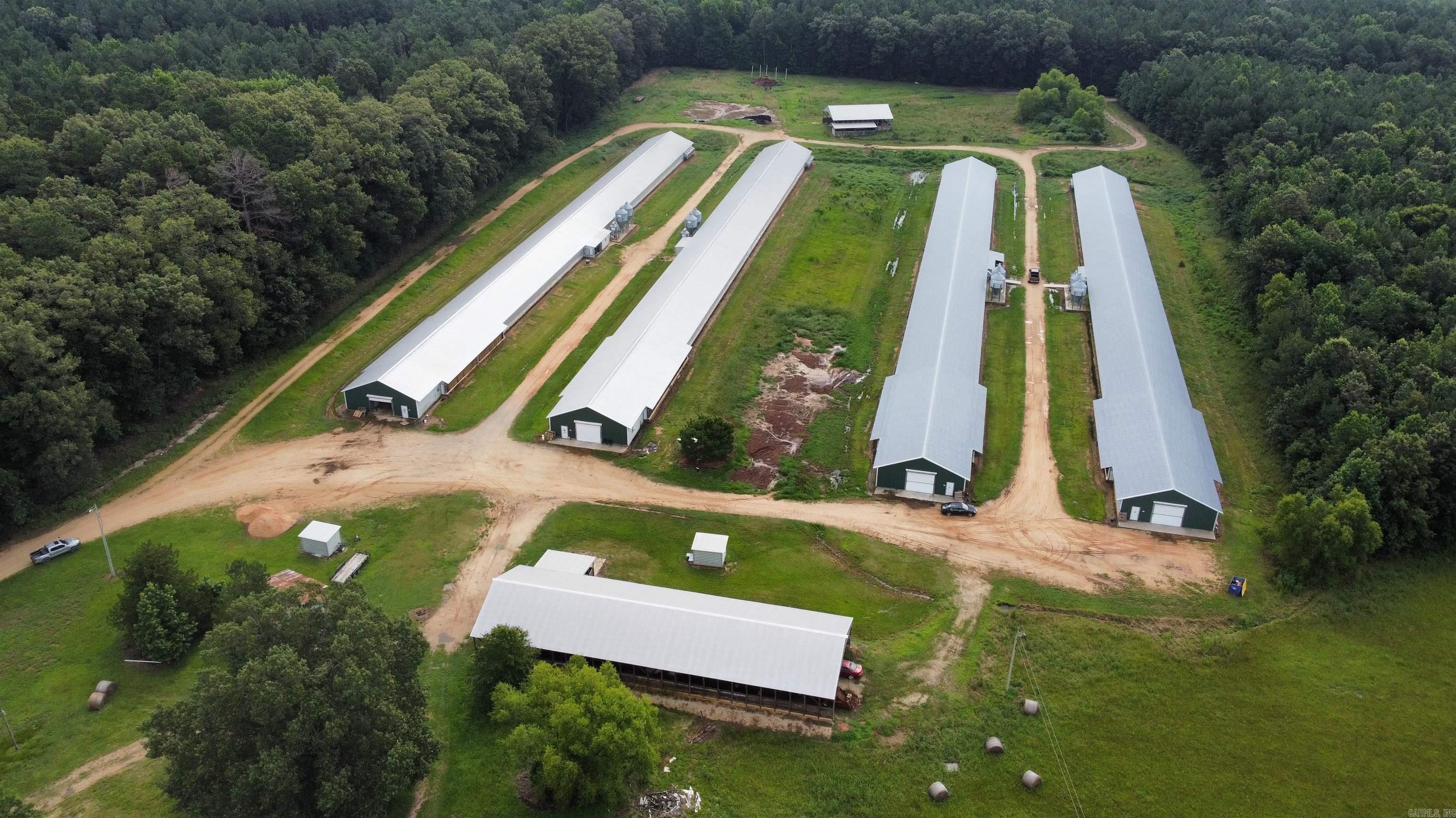 Located just minutes away from Warren, AR sits this 4 layer house farm that is turn key ready, offering an excellent opportunity for someone entering into the farming business or expanding their operation. It features 4 layer houses, 2 litter sheds, an equipment shed, 2 water wells, 2 back-up Taylor generators, back-up rural water. This farm is nestled on 38+- acres of exceptional land. It features a 2 bedroom, 1 bath farm house. All updates have been completed, and there are no required updates needed. 2 of the houses were built in 2015 and 2 houses were built in 2018. This is a great investment with proven income and exceptional equipment. Contact me today for more info. Thanks, Josh Nichols with White Oak Realty.