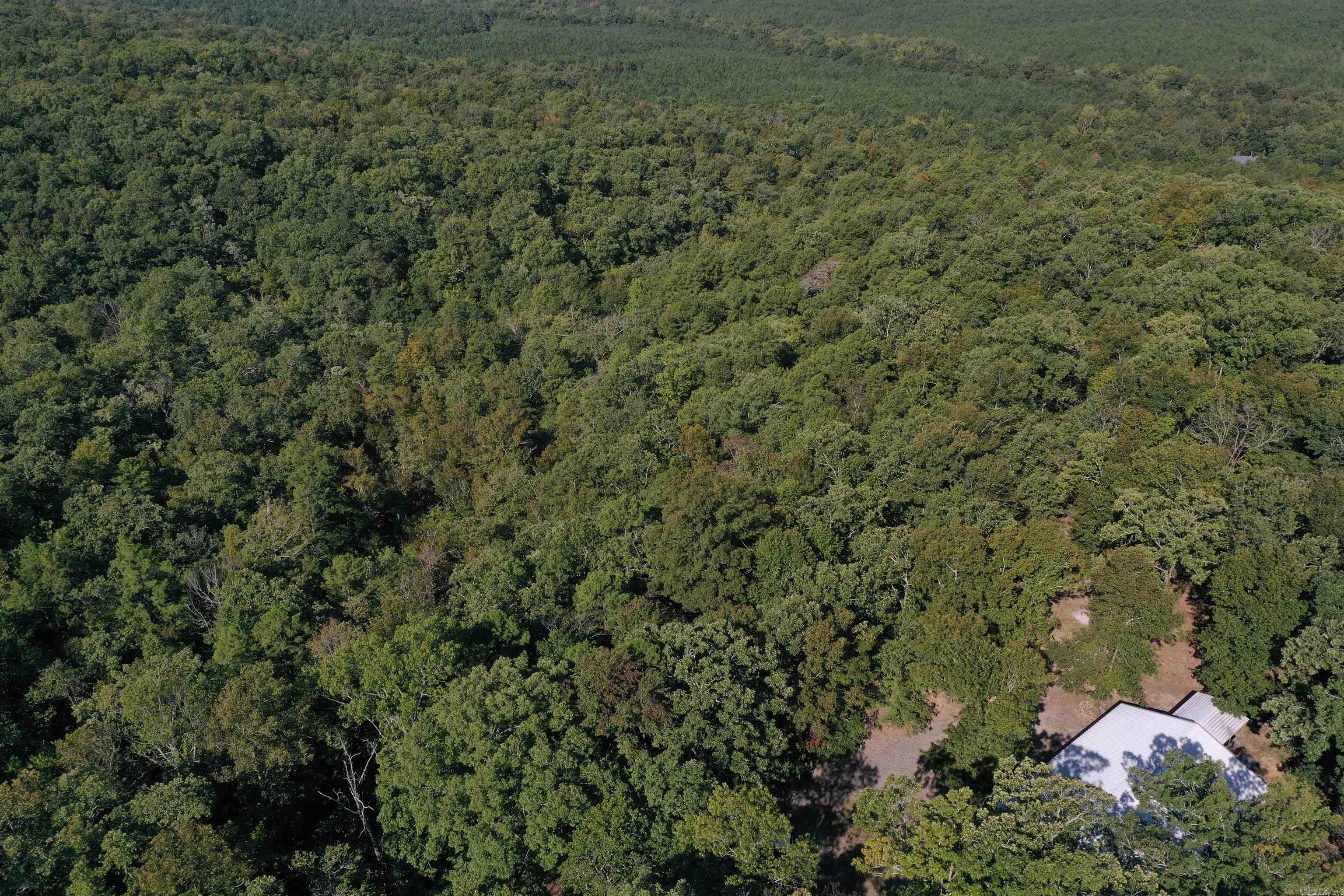 Located Just outside of Hot Springs, this secluded yet convenient outdoorsman’s paradise is ideally located for the perfect blend of quiet space and ammenties. The 108 +/- acres sprawls across a hardwood timberland with ranges in topography that create great stand locations for both deer and turkey, as well as phenomenal mountain views. The property boasts over one mile of boundary with City of Hot Springs and Arkansas Department of Agriculture land, assuring no encroachment and great outdoor opportunities for a lifetime. If you are looking for a quiet and secluded hunting tract that still has the convenience that Hot Springs has to offer, you do not want to miss this unique piece of Garland County Real Estate. Properties that offer this amount of seclusion and Public Land Boundary rarely come to the open market. • 108 +/- Acres • 1380 Square Foot Barndominium • 600 Sq. Ft. Attached shop with large front porch • Over 1 Mile of Public Land Boundary • End of Dead-end Road • Excellent Topography • Great Mountain Views • Abundance of Deer and Turkey • ATV trails • Secluded Setting • Water Well • Minutes to Hot Springs