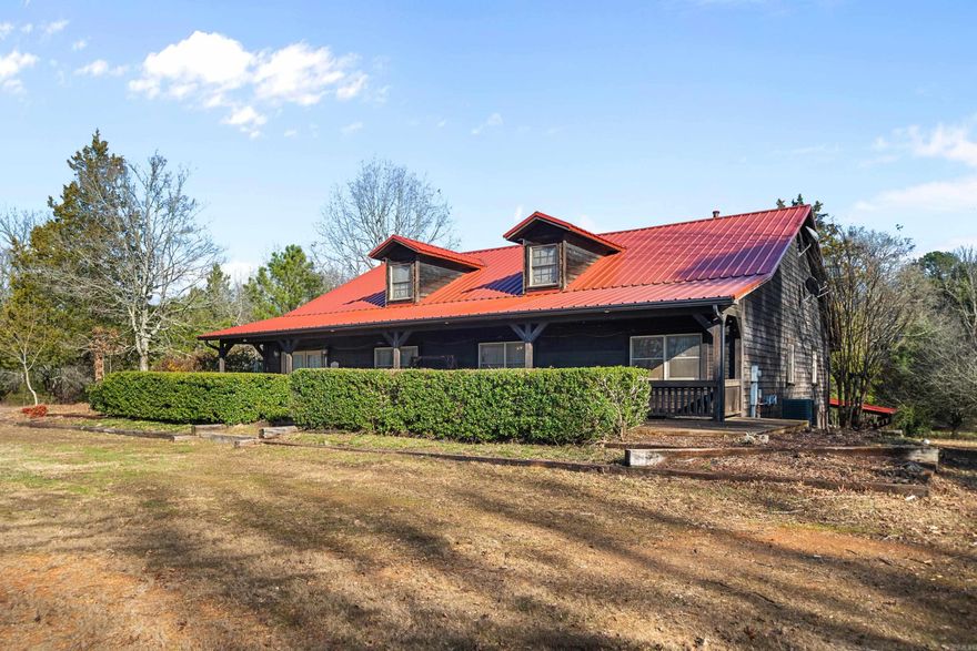 Welcome to your private oasis nestled in the serene countryside just outside the city limits of Hot Springs. This property includes 2 acres, which offers a beautiful custom built home. The impressive 5,099-sq. ft. home features 1 BR & 1 BA on main level & 3 BR's & 2 BR's upstairs, providing ample space for both family living & entertaining. Step inside to discover a thoughtfully designed interior. The heart of the home showcases a stunning 2-sided fireplace, creating an inviting atmosphere seamlessly connecting living spaces. The primary bedroom serves as a peaceful retreat, while other bedrooms offer plenty of space for guests. Outside, summer dreams come true w/outdoor kitchen on patio & sparkling in-ground pool, perfect for refreshing dips & poolside gatherings. Property improvements include a new metal roof, ensuring peace of mind for years to come. Detached garage provides space for vehicles, storage, or potential workshop. Location is everything. Just 9 minutes from the recreational paradise of Lake Ouachita, you'll have easy access to boating, fishing, & waterfront activities. Nature enthusiasts will enjoy Cavanagh lookout, breathtaking views & hiking opportunity.