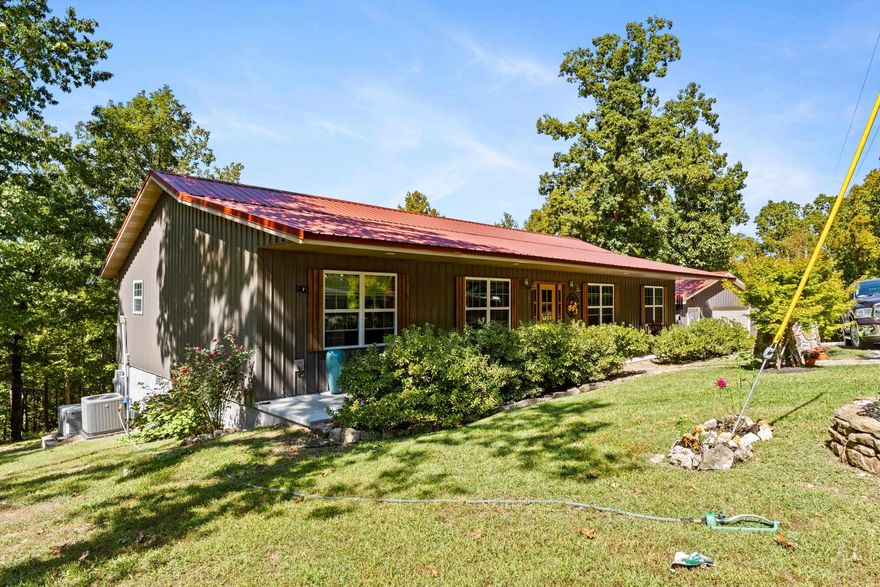 Welcome to this beautifully maintained 3 bed, 2 bath ranch-style home with office in the desirable Matthews Mountain Estate community, just minutes from Mountain View. Built in 2020 and enhanced by recent updates, this 2,000 sq. ft. single-level home blends comfort, space, and function. The open floor plan features a bright kitchen with large island and concrete countertops, flowing into the dining area with a new wood-burning stove and a living room anchored by a gas log fireplace. The private primary suite offers a walk-in shower and generous closet space, thoughtfully separated from guest bedrooms. Outdoor living shines with a 6-person hot tub, newly expanded raised-bed garden, and spacious side deck for relaxing or entertaining. Set on 7.15 acres with a 24x36 garage, 2-car carport, RV pad, metal roof, and whole-house Generac generator, this property offers beauty and peace of mind. Ask for the complete list of recent updates and see how this home stands apart.