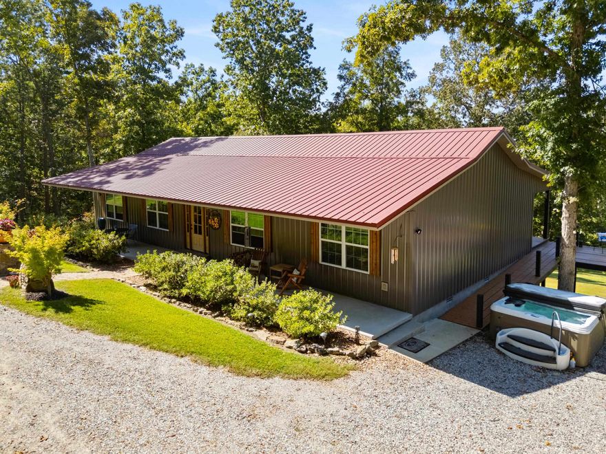 Welcome to this beautifully maintained 3 bed, 2 bath ranch-style home with office in the desirable Matthews Mountain Estate community, just minutes from Mountain View. Built in 2020 and enhanced by recent updates, this 2,000 sq. ft. single-level home blends comfort, space, and function. The open floor plan features a bright kitchen with large island and concrete countertops, flowing into the dining area with a new wood-burning stove and a living room anchored by a gas log fireplace. The private primary suite offers a walk-in shower and generous closet space, thoughtfully separated from guest bedrooms. Outdoor living shines with a 6-person hot tub, newly expanded raised-bed garden, and spacious side deck for relaxing or entertaining. Set on 7.15 acres with a 24x36 garage, 2-car carport, RV pad, metal roof, and whole-house Generac generator, this property offers beauty and peace of mind. Ask for the complete list of recent updates and see how this home stands apart.