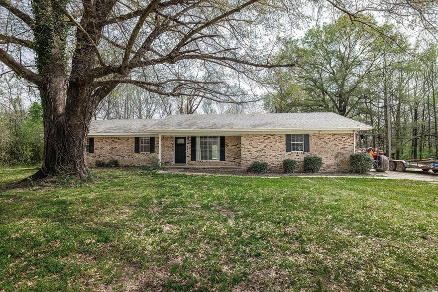 Situated on a picturesque 2.66-acre lot, this beautifully updated 3-bedroom, 2-bath home offers the perfect blend of modern comfort and peaceful country living. Inside, you'll find stunning new LVP flooring throughout, complementing the home's fresh and inviting atmosphere. The newer HVAC unit and appliances provide efficiency and reliability, while the spacious laundry room adds convenience to daily life. A two-car garage with extra storage ensures plenty of space for vehicles and tools. Outside, two outbuildings, including a 24x36 barn, offer endless possibilities for hobbies, livestock, or additional storage. The small pond enhances the property's charm, creating a serene setting just a short drive from town. Don't miss this rare opportunity to own a beautifully updated home with ample space both inside and out!