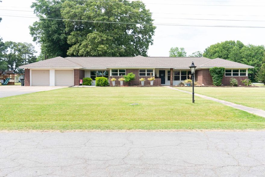 Timeless charm meets thoughful modern updates in the beautifully maintained home situated on a spacious courner lot w/an additional adjoining lot, offering a rare 1.04 acres of space & privacy. Inside you'll find original hardwood floors full of character, and inviting hearth room & separate family too designed fo rboth comfort & entertaining, & a kitchen filled w/abundant cabinetry, massive breakfastbar & rom to gather. The oversized laundry room adds eveyday convenience, while new lighting & blinds throughout the home create a fresh, elegant feel. Tongue & groove ceilings add warmth and archectural charm, & the home has bee exceptionally upgraded for efficiency & peace of mind w/blown insulation in the attic 2022. Major improvements include windows 2020, roof 2020, water heater 2020, HVAC (outside unit 2026) Additional features such as pre-wiring for generator & dedicated Christmas light plugs make this home as practical as it is beautiful. A rare blend of classic craftsmanship,modern efficiency & timeless elegance.  DON'T MISS THIS ONE!