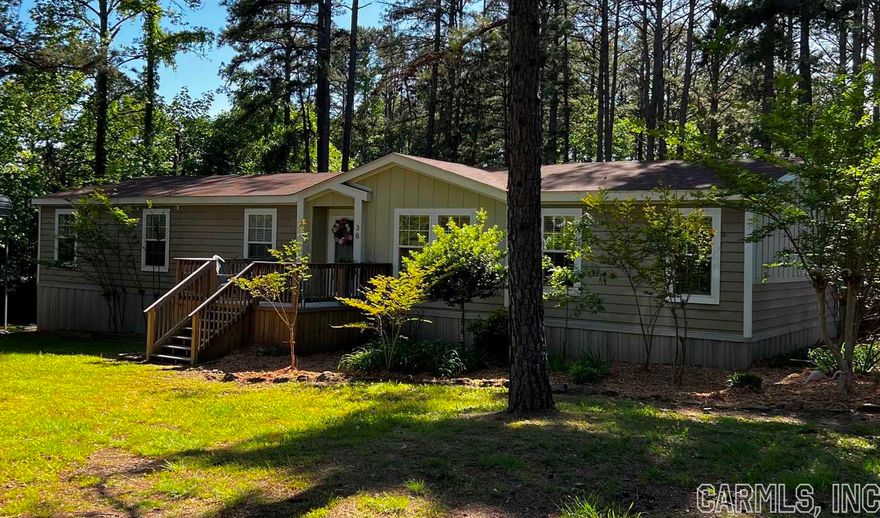 This beautiful 1,920 sqft manufacture home is like “brand new”.  Nestled on a beautiful property. Truly a peaceful place, nestled in the tall pines.  You would have NO idea this is even a manufacture home. It’s an open floor plan, and has sheet rock & trim in the entire home. It’s stunning!  Was currently used as a weekend getaway ONLY!  The fireplace still has tags hanging, & there has never been one single nail for hanging pictures on the walls in this beauty!  There are bedrooms that have never been lived in. Just waiting on you & your family to break it in!  *4 Beds/ 3 Full Baths *Stainless Steel Appliances  *Formal Dining RM *Master suite with huge walk in closet with build-ins *Jack&Jill Bathroom  *Large Deck  *Large yard Fenced *Covered Boat Parking *Covered RV Parking *At full price the RV can be available to go with the property. It has less than 30k miles on it.  **Plus property is furnished (minus the stage accessories) It’s flawless!