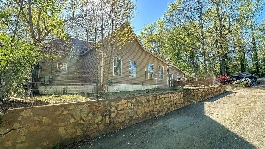 Make an Offer! City living nestled in the woods. 3 Bed 1 Bath Partially renovated home located in the heart of Hot Springs. The only house on the street with a detached Garage/shop and Check out the large bathroom with soaker tub. This property backs up to Cedar Glade Mountain close to hiking trails and wildlife. Perfect for taking your pups for a stroll. This area has been getting a solid face lift for the last few years. The seller is motivated and ready to make a move.