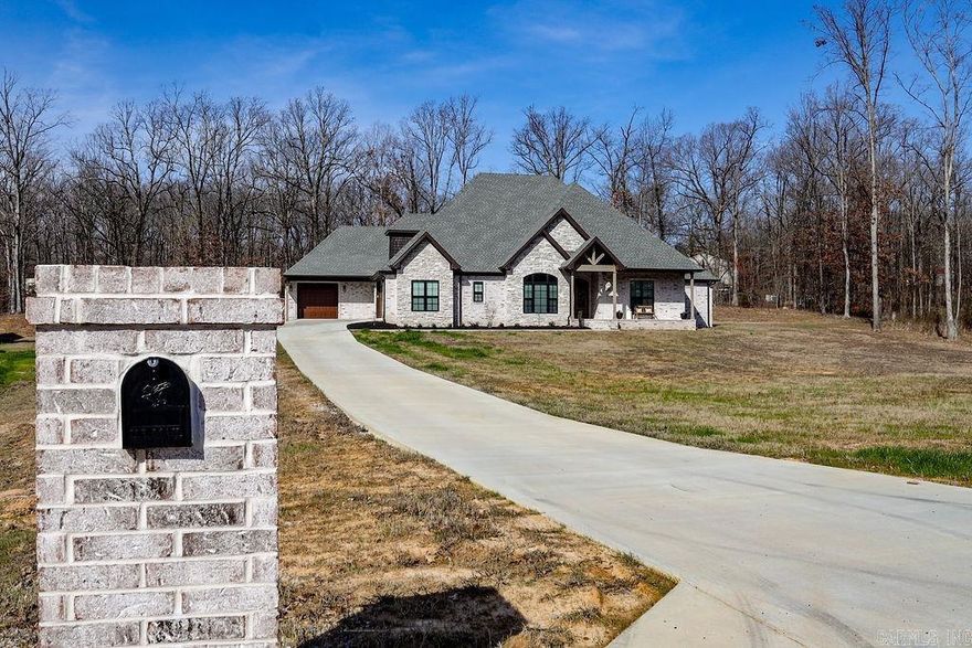 WOW!! Take a look at this custom build sitting on 1.57 acres of Crowley's Ridge. This home has a fabulous kitchen with a large butler's pantry. You will never run out of storage in this kitchen & so much room for entertaining! The farmhouse sink, granite countertops, & gas range are a dream come true. The living room is open with vaulted ceilings, a wood beam, & the gas fireplace is flanked by built-ins. French doors lead to a big screened-in porch with a fireplace to enjoy peaceful country evenings. The formal dining room is filled with lots of natural light from it's picture window. Barn doors off the living room lead to an office with incredible built-ins inside the closet. The master has a tray ceiling with a French door leading to the screened porch. Two 2 walk-in closets (one doubling as a safe room), dual vanities, a soaker tub, & a walk-in tile shower are all located in the primary bathroom.