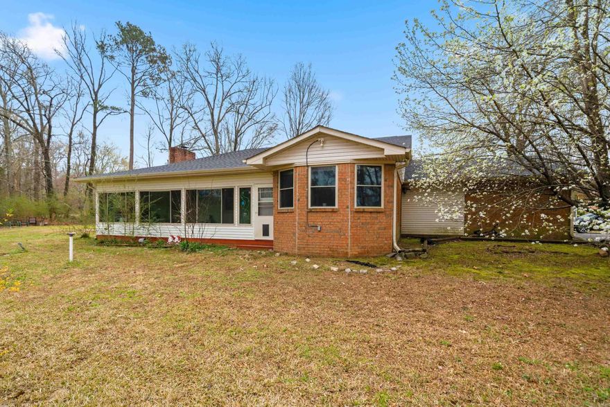 Welcome to this beautiful 3 bedroom, 2 bath home situated on 2 peaceful acres in the highly sought-after Lakeside School District.  Thoughtfully updated, this home features new flooring throughout, offering both style and durability.  The inviting living area is anchored by a wood burning fireplace, perfect for cozy evenings while the bright sunroom provides a relaxing space to enjoy views of the surrounding property year round.  The spacious layout offers comfortable living with plenty of natural light and room to spread out both indoors and out. This property offers the perfect blend of privacy, comfort, and convenience just miniatures from town while still enjoying a county feel.  New roof 2025! A rare find with acreage in Lakeside-don't miss this opportunity.