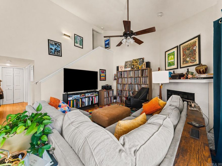 Sunlight pours through every room of this beautifully appointed 3-bedroom, 2-bath condo nestled in the heart of coveted Huntleigh Woods. Custom cabinetry flows throughout the entire home, setting this unit apart with a level of craftsmanship and warmth rarely found at this price point. The open, light-filled layout welcomes you immediately — hardwood floors, a wood-burning fireplace, and soaring ceilings create a home that feels both elevated and lived-in. Step through the slider onto your private wood deck and lose yourself in a lush canopy of mature trees — a serene nature retreat right outside your door. In-unit laundry room, covered assigned parking, and generous storage add everyday convenience. Huntleigh Woods is one of Hot Springs' most sought-after communities, offering a sparkling community pool, beautifully maintained grounds, and trash service — all covered by a low monthly HOA. Minutes from premier shopping, dining, and all that Hot Springs has to offer. This is the one you've been waiting for.