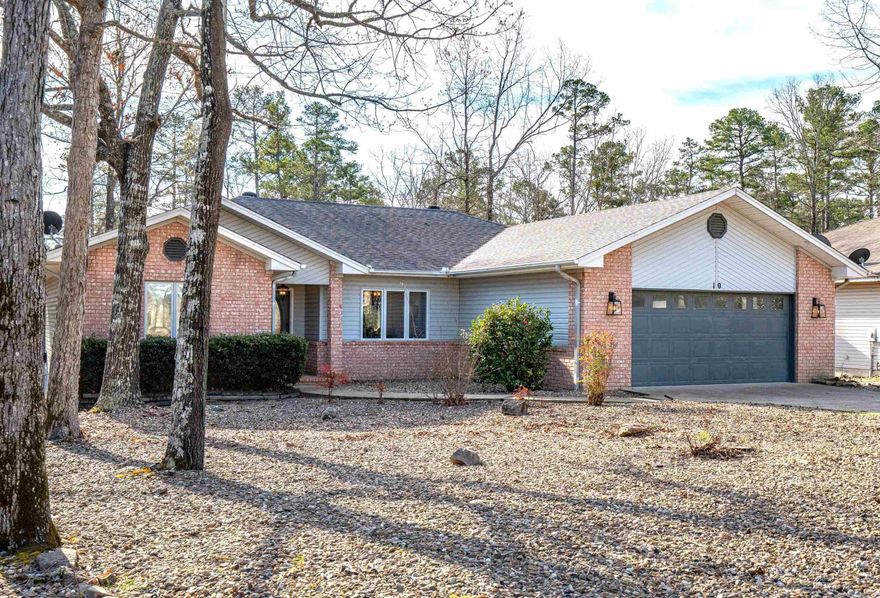 HThis home is magazine/decorator worthy…stunning is the word!  Perfect open-style living, with a dining area, living room, kitchen & eating area. Get cozy with the gas fireplace-perfect to enjoy on those cold or rainy nights!  Plus, enjoy a very good size sunroom full on windows to enjoy your privacy. The brand new patio deck looking out to all the trees, squirrels, deer, birds will be so relaxing!  The bedrooms are split, with the primary bedroom to the right with its en-suite featuring a wall-in shower and also a soaking tub, double sinks, and a nice sized walk-in closet.  The other two bedrooms and bathroom are on the left side of the home.  It is currently a VRBO-Airbnb property.  All furniture and furnishings are for sale separately, so it would be an easy move-in ready home.  It’s also very near the Lake Coronado boat launch, to enjoy our 2nd largest lake in Hot Springs Village. This street is an culdesac, so very light traffic.   Also close to three property owners exit gates, for easy travel.  Agents: see added remarks.