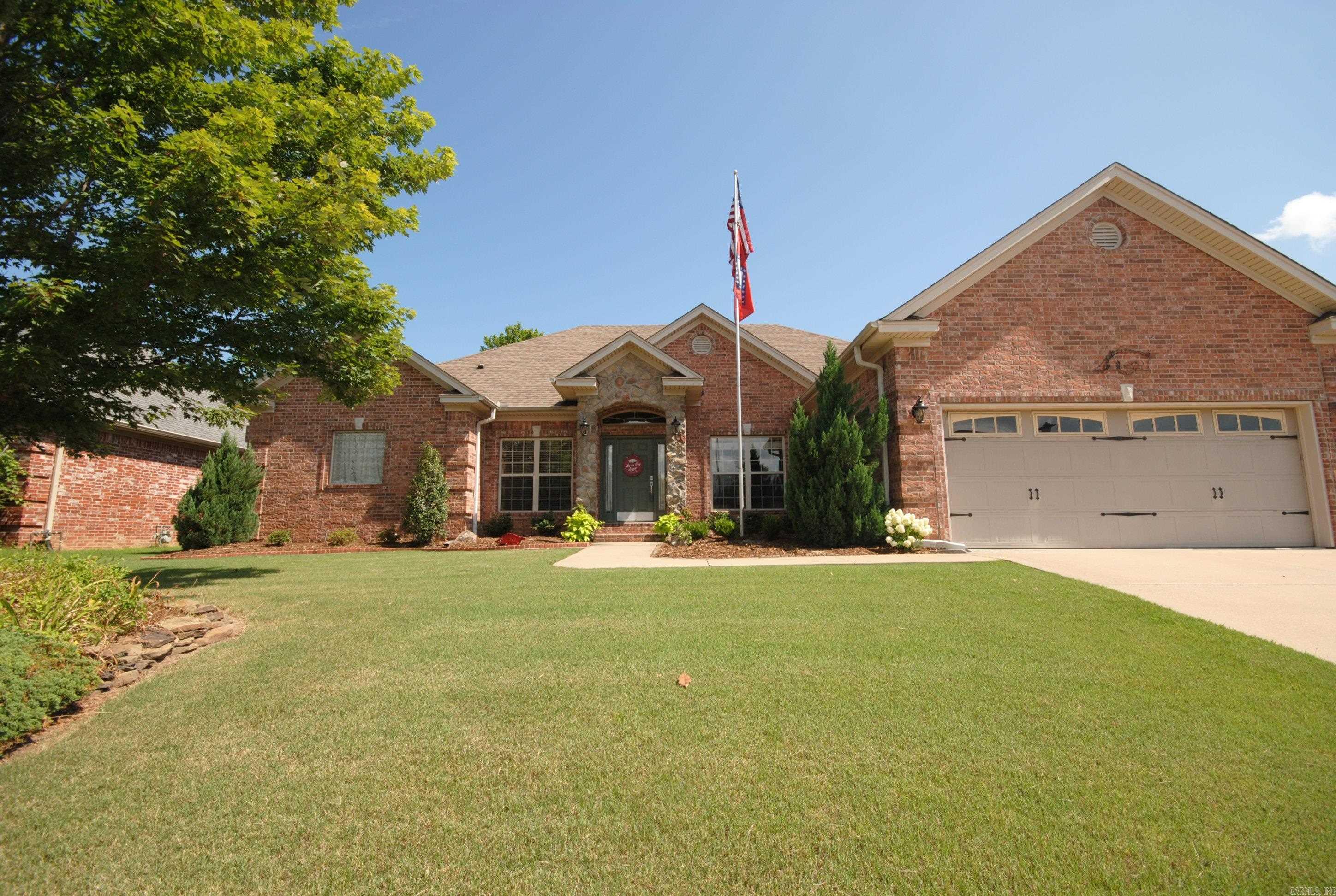 Beautiful one level home in Maumelle Valley Estates on quiet street next to walking trail. Enjoy extended and covered patio in backyard with built in gas grill. Professionally landscaped yard. Inside is large living area with high ceilings, custom trim work throughout home and built-ins. Spacious separate dining room and bonus room could be office. Kitchen has center island, granite slab countertops, tons of storage, gas cooktop with new downdraft vent, and eat-in dining area. Exceptional layout allows kitchen to open to living area but not seen from the front door. Plenty of room for multiple cooks. Separate primary suite features access to patio and backyard, his and her closets, lots of natural light, and update bath with quartz countertops and new lighting. New neutral paint throughout the home and wood floors in all the rooms were updated with current owner. Two separate guest rooms are on the other side of the home with a full bath. Laundry room and half bath off the entry from the garage.