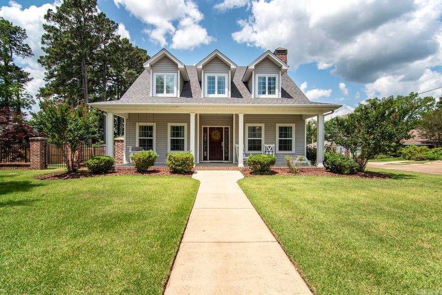 Nestled on a desirable corner lot just blocks from Ouachita Baptist University and downtown Arkadelphia, this stunning custom-built home by Richard Harp Homes offers elegance, and unparalleled convenience. As you step inside, you're greeted by engineered hardwood flooring that flows seamlessly throughout the main level. The private primary suite provides the ultimate retreat, complete with his-and-her closets and interior wall insulation for a peaceful escape. The spa-like primary bathroom features dual vanities, a luxurious soaking tub, a fully tiled walk-in shower, and a private water closet for added privacy. The thoughtfully designed layout includes a double-door office off the great room, perfect for working from home or creating a quiet study space. The chef’s kitchen is both functional and stylish, boasting granite countertops, a gas range, stainless steel appliances, and a refrigerator—all ready to make meal prep a joy. Upstairs, two additional en-suite bedrooms offer privacy and comfort for family members or guests, while the main level also includes a convenient half bathroom. This home truly has it all, blending timeless style with modern amenities. Come see today!