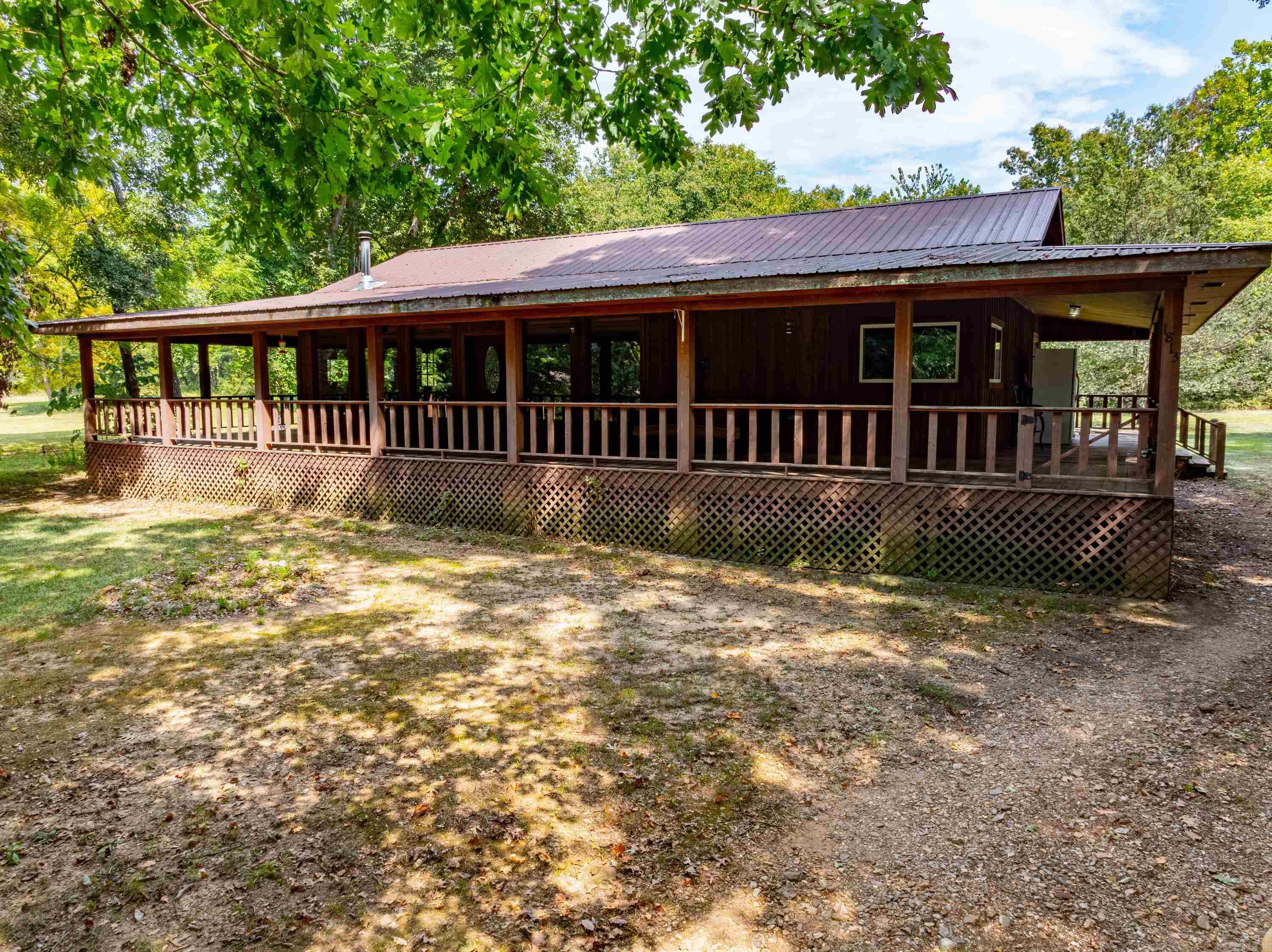 155 +/- Acres, 3 Houses, Barn, Pasture, Woods, Fenced, 2 Ponds, at the Dead End of the Road, Randolph County, Arkansas!This beautiful property, located in the tranquil setting of Randolph Springs in Randolph County with a physical address of Pocahontas, Arkansas, is a homesteader's dream.Spanning approximately 155 acres, this estate offers a perfect blend of open pastures, serene woodland, and abundant wildlife, making it ideal for those seeking a self-sufficient lifestyle in the Ozarks.As you arrive at the property, you're greeted by a charming entrance that leads you past five stallsāideal for storing equipment or vehicles.The property also features a barn that, while aged, is still perfectly usable and adds to the property's functional charm.For those with a green thumb, there are plenty of places to cultivate gardens, offering the opportunity to grow your own food and embrace a sustainable lifestyle.The property also includes a quaint little cabin perched on a hill, offering solitude and charm.Additionally, there is a unique home overlooking one of the property's two ponds, with a wraparound porch that provides stunning views.
