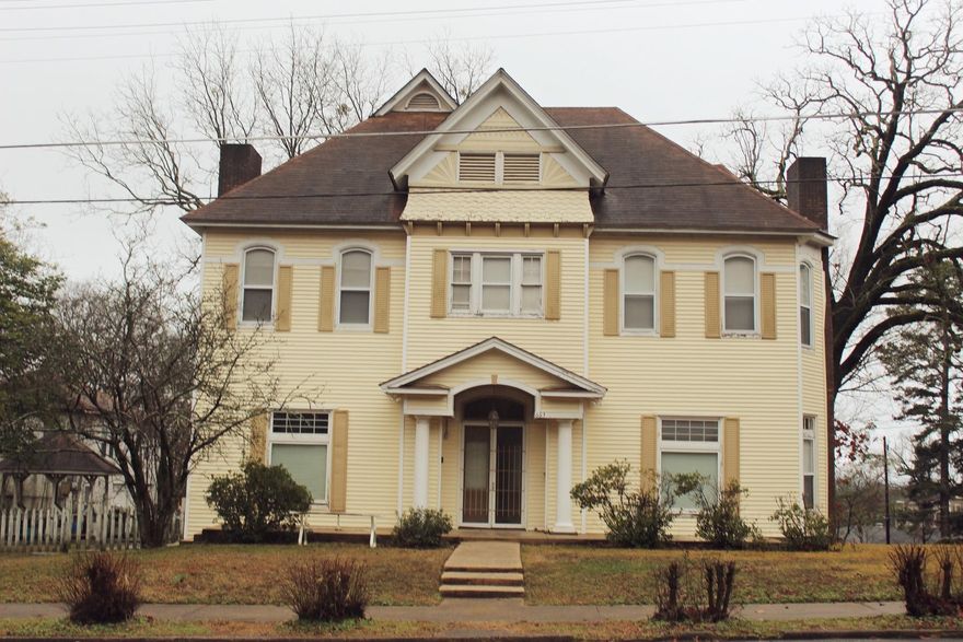 *More Pics coming soon* Come and check out this beautiful, Colonial Revival style home in the historic Quapaw/Prospect District, just minutes away from the charming Bathhouse Row and all of the other amenities along Central Avenue in Hot Springs National Park.  This lovely gem features hardwood floors, tiled kitchen and bathrooms, closets in the bedrooms which is a rarity in a house of this age, his and her master baths, pocket doors, French doors, custom blinds throughout.  Another cool feature of the property is there's a detached garage (220 Violet) with a 600 sqft apartment above which could be utilized as a teen's room, guest room, or even a rent house for the potential of addition income.  May need a little TLC and imagination, but the possibilities are endless.  Outside, you have a spacious front yard for holiday decorating, and a fenced in backyard with a gazebo that is perfect for kids and family pets.  Also, four rebuilt fireplaces with inserts for cozy ambiance or additional heat on the coldest nights.  Come schedule an appointment and see for yourself.  *See Agent Remarks*