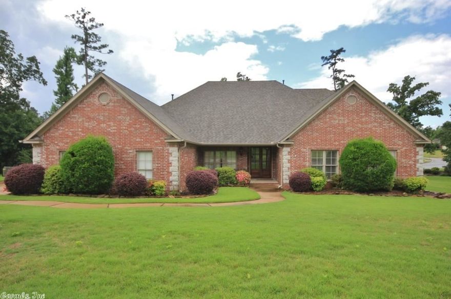 Beautiful Home on flat lot.  This home is mostly one level.  Open dining to great room.  Hearth room open to kitchen with vaulted ceiling.  Small playroom off kitchen. Master bedroom separate.  Three additional bedrooms with two baths.  Upstairs has large bonus room plus bedroom and bath.  Walk-out backyard with covered patio.  Three car side load garage.  Newer HVAC and Roof.  Come see!