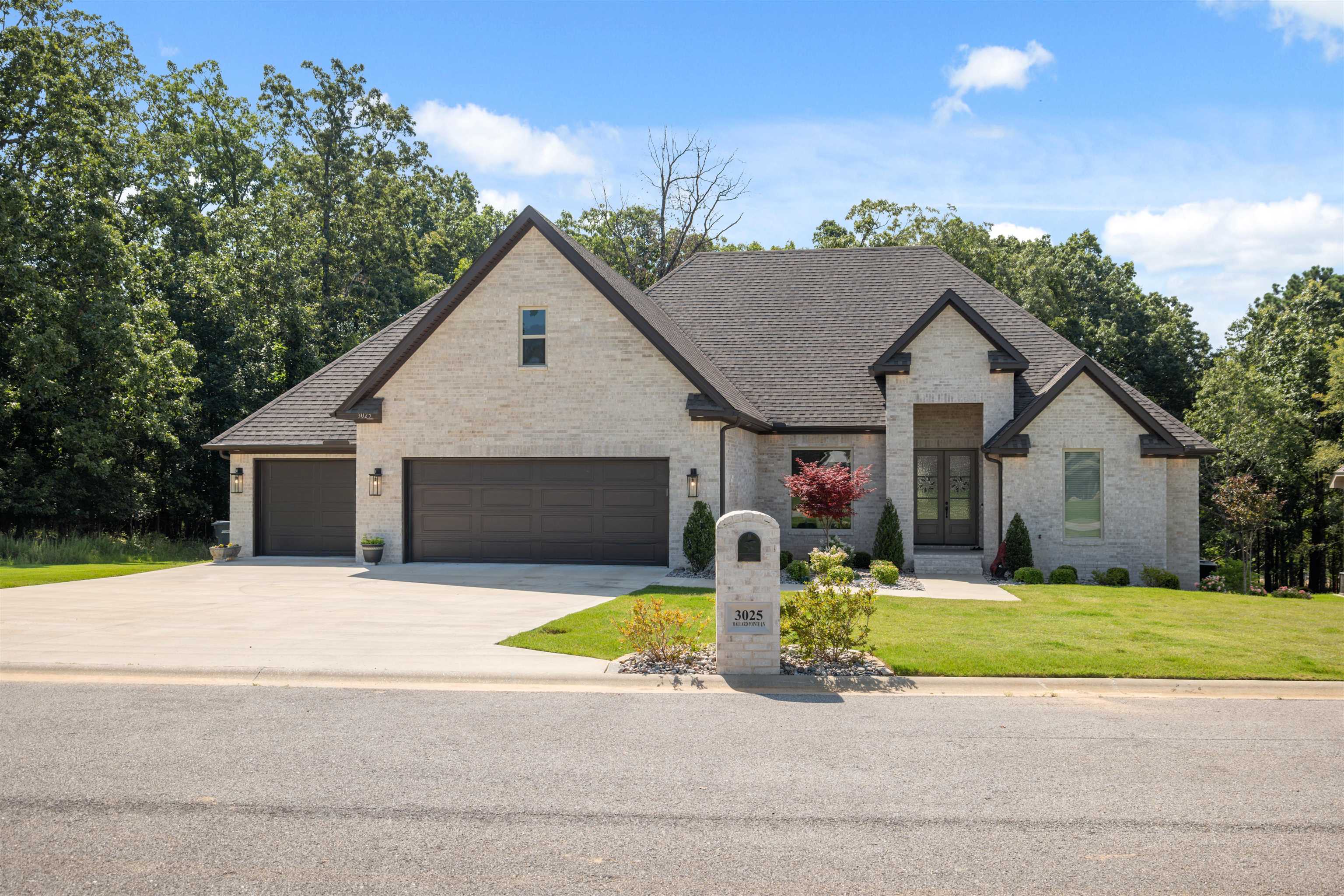 Prepare to fall in love with this stunning 5-bedroom, 4.5-bath home located in one of Jonesboro's most desirable neighborhoods! Step inside and discover a gourmet kitchen with granite countertops, a 6-burner gas stove, and plenty of space to create unforgettable meals. The laundry room includes a sink and abundant storage, making daily tasks a breeze. The primary suite is truly a retreat, featuring a massive walk-in closet, a luxurious soaker tub, and a spacious walk-in shower with a soothing rain-head perfect for unwinding after a long day. A spacious 3-car garage provides plenty of room for vehicles, tools, or hobbies. Enjoy outdoor living with a cozy fireplace on the covered back porch and a large deck that leads to a beautifully secluded backyard. The land directly behind the property is land locked offering extra peace and privacy with a potential option to purchase it as well. This home is perfect for entertaining and everyday living alike. Don't miss your chance to see it in person! Call or text today to schedule your tour!
