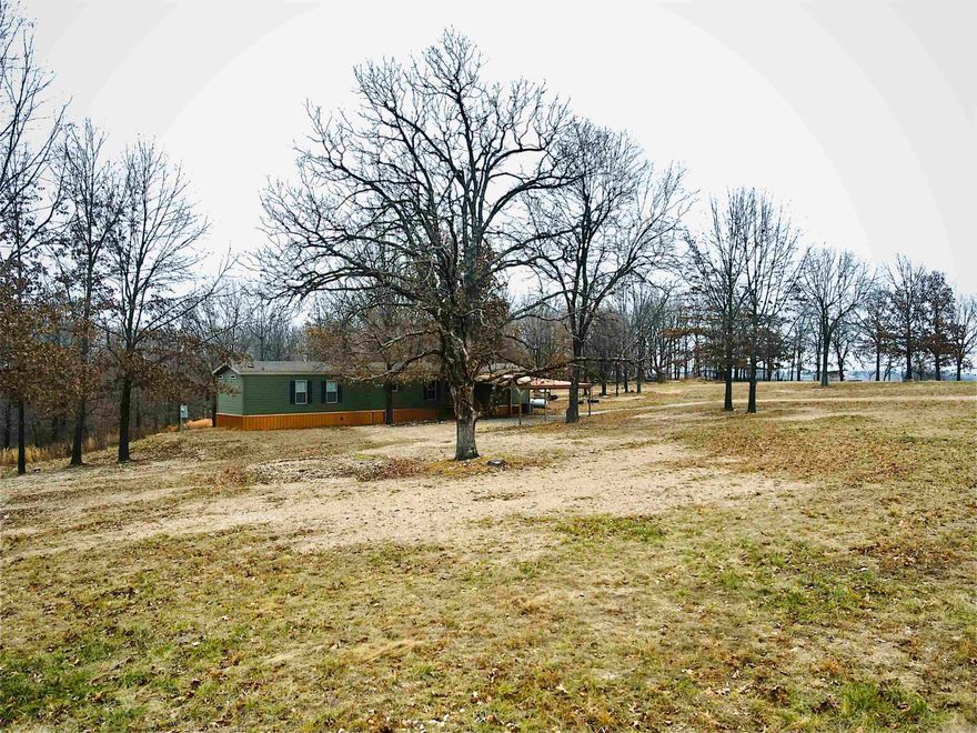 Beautiful 17± surveyed acres featuring a like brand-new 1,280 sq ft mobile home built in 2023 with 3 bedrooms, 2 bathrooms, covered front and back porches, and a covered carport for parking. Utilities include electric, septic, and a private well approximately 555 feet deep producing around 9 gallons per minute. The property offers a great mix of open and wooded ground, a stocked pond, and abundant wildlife, making it ideal for country living, recreation, or a peaceful rural retreat.