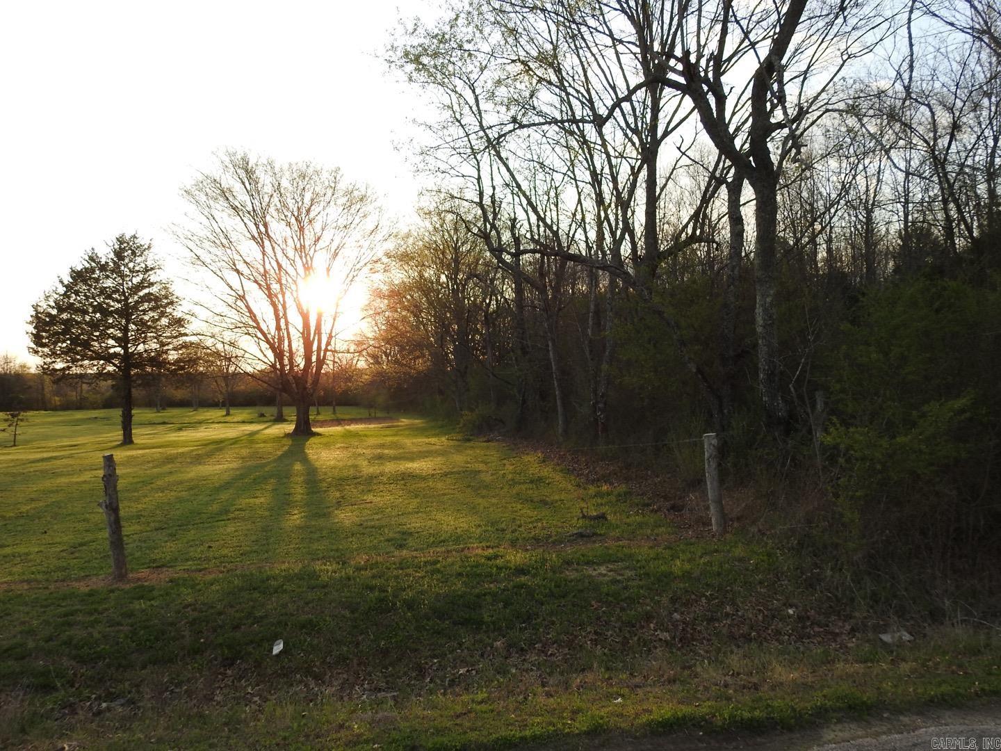 Unrestricted land located at intersection of Old Hwy 167 and Hwy 87. This Level 6.4 acre lot has all major utilities at the road and loaded with mature hard wood trees. Great sites for building your dream home or business. ***Agents see remarks
