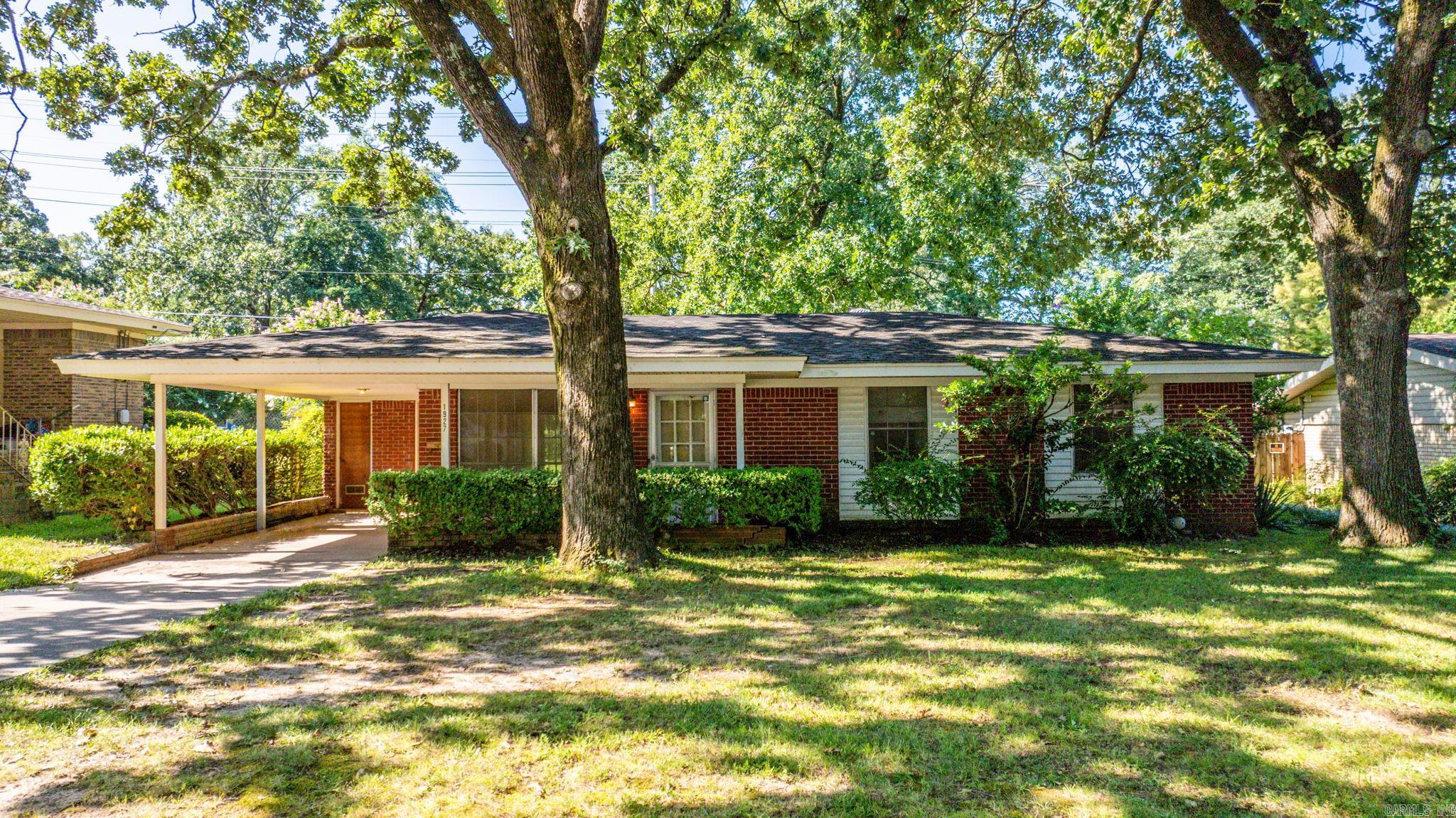 Make this house your own! 3BR/1.5BA - All original appliances and flooring so does need work! All Brick, 1-Car Carport, Fenced backyard and patio! Priced Accordingly. Sold AS IS - no repairs!