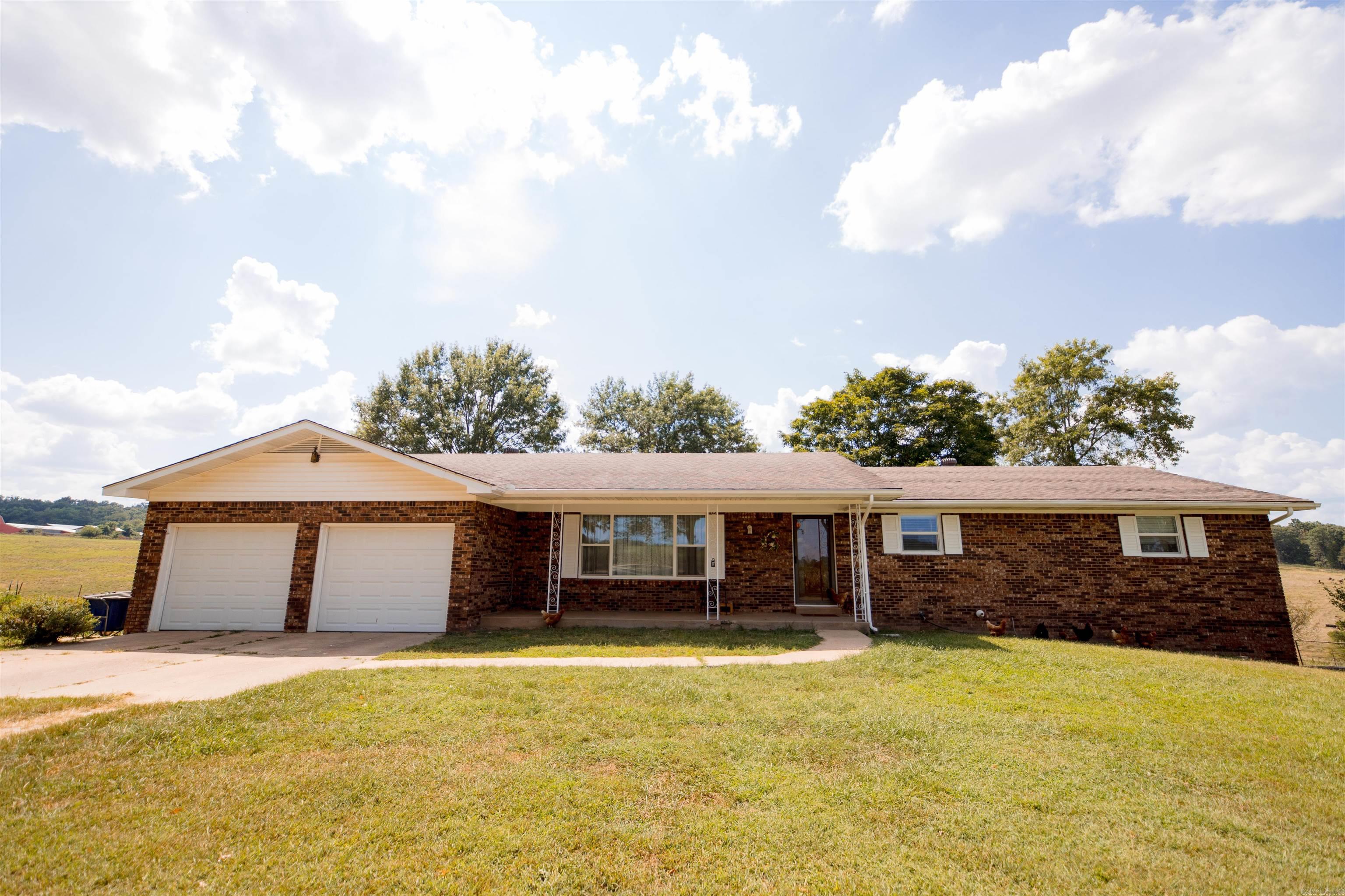 Fantastic 1 1/2 ac Hobby Farm is turn key and ready to go for your chickens, horse or cow and garden. Neat 3BR, 2 BA brick home with large gas log fireplace and partial basement for more living space or storage. Pretty views from the covered deck and front porch. Fronts county road 10 mi from Harps grocery and only 20 min into Harrison. Within an hour of Branson, MO, Table Rock, Taneycomo, Bull Shoals & Norfork Lake, the Buffalo, White & Norfork Rivers, Crooked & Clear Creek just min away. Come and explore all the Ozarks have to offer with multiple canoeing, kayaking, swimming, fishing, hunting, hiking, camping and sight seeing opportunities! All #'s are approximate.