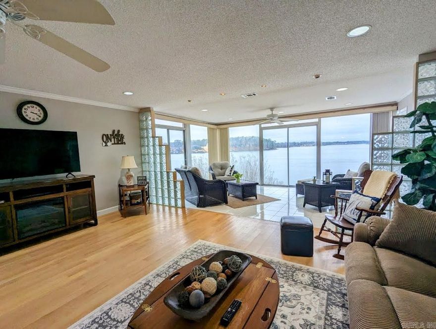 Location, location, location. Can't ask for a better lake view than this! The outstanding views of Lake Hamilton from the enclosed patio set the tone for the entire condo. The upgraded galley kitchen has all new appliances and the granite countertops throughout do not disappoint. The bathroom remodels, especially the master bath, with the added square footage and larger vanity, really make this unit one of the most desirable in the complex! The furniture is negotiabale and the boat stall conveys at closing to the new owner.