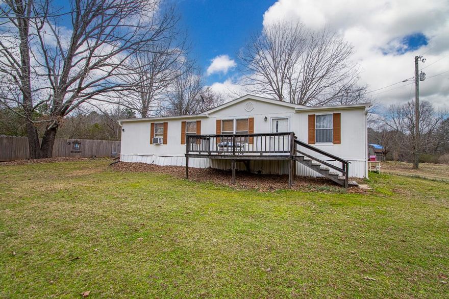 This cute little country home sits on 2 peaceful acres, giving you plenty of space to enjoy the outdoors. With 1,568 sq ft, it has 3 cozy bedrooms and 2 bathrooms—just the right size for easy living. Built in 1999, the manufactured home feels warm and comfortable, with a homey vibe.  Outside, there are 3 small storage sheds—great for keeping all your tools or outdoor stuff. But the best part is the wooded deck! It’s the perfect spot to relax, sip your coffee, and watch the deer wander by. It’s a quiet, laid-back place to enjoy the simple things in life, surrounded by nature.-Pictures scheduled for Monday