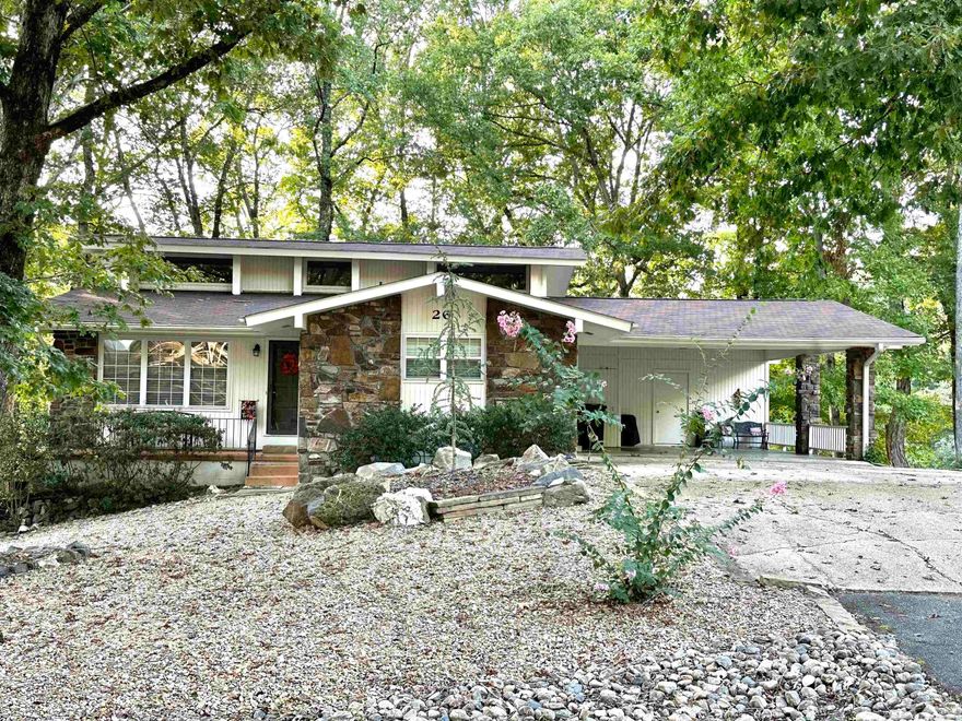 Turn key short term rental on Evolve with bookings and fully furnished! Roof replaced this year. Water heater, refrigerator & dryer new in 2021. Crawl Space Solutions did full encapsulation of basement this past year$ Double pane thermal windows with natural light in this charming home. Laid out for multiple living spaces and privacy! Situated on the 15th hole of DeSoto Golf course with both open and enclosed rooms to enjoy the view, birds, golfers and other wildlife that enjoy the golf course after hours! Window units in two bedrooms are in addition to the central HVAC (one yr old) for added comfort to guest. Seasonal décor and items for the home convey. Dry storage room with large access door at the head of carport. Wide level driveway. This has been a profitable business for the existing owner since 2018.