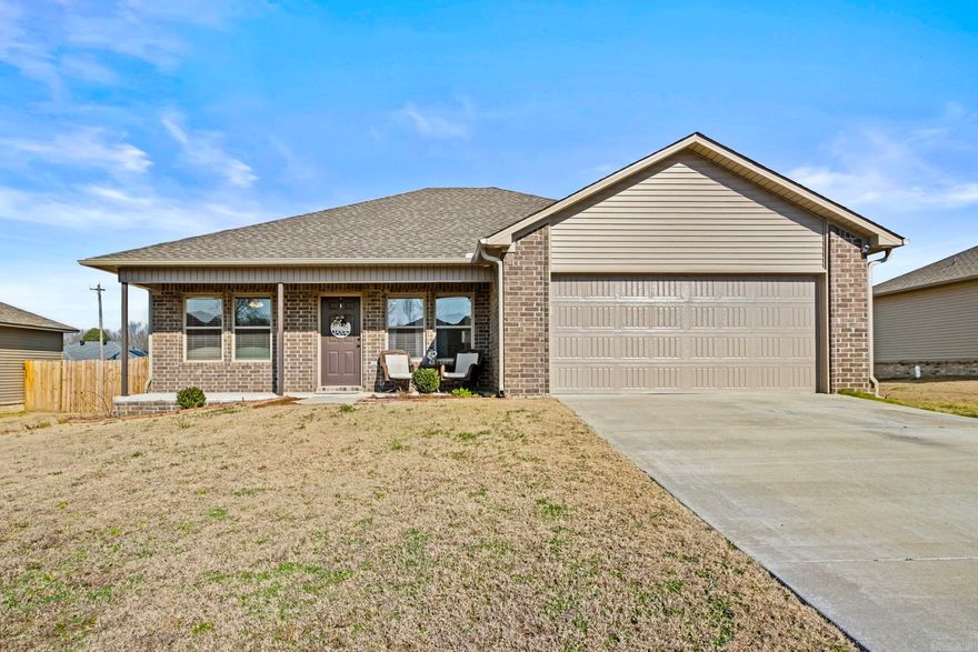 Adorable home with NEW white paint throughout ('25) and NEW ROOF along with siding and gutters on one side in Aug. 2024.  NEW laminate flooring also installed last year! The open floor plan with living room open to kitchen and dining includes a vaulted ceiling and is sure to please! Quartz counters with subway tile backsplash and farmhouse sink are great anchors in this pretty kitchen. Stainless steel appliances and a breakfast bar complete the package! The primary suite boasts a tray ceiling, laminate floors, ceiling fan and ensuite bath. Bath features include a large shower with Carrera marble tile surround, double sinks, private toilet closet and walk in closet. Two guest rooms also feature laminate flooring and ceiling fans. They share a hall bath complete with quartz countertop and tub/shower combination. Exterior features include a covered patio, low maintenance vinyl siding/brick and a fully fenced, level yard. Situated on a quiet cul de sac, this home has it all!