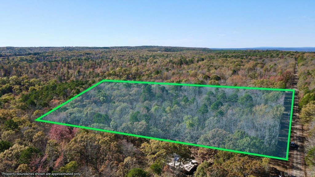 5.67 Acres – Flat, Buildable, and Ready. This level lot offers gravel road frontage, easy paved access, and utilities at the road. Just a 14-minute walk to The Barn at Greers Ferry Lake and 11 miles to Peters Sugar Loaf Marina. Walmart and Ozark Health are all nearby. Perfect for building, recreation, or investment. No restrictions. GPS: 35.51942, -92.33948
